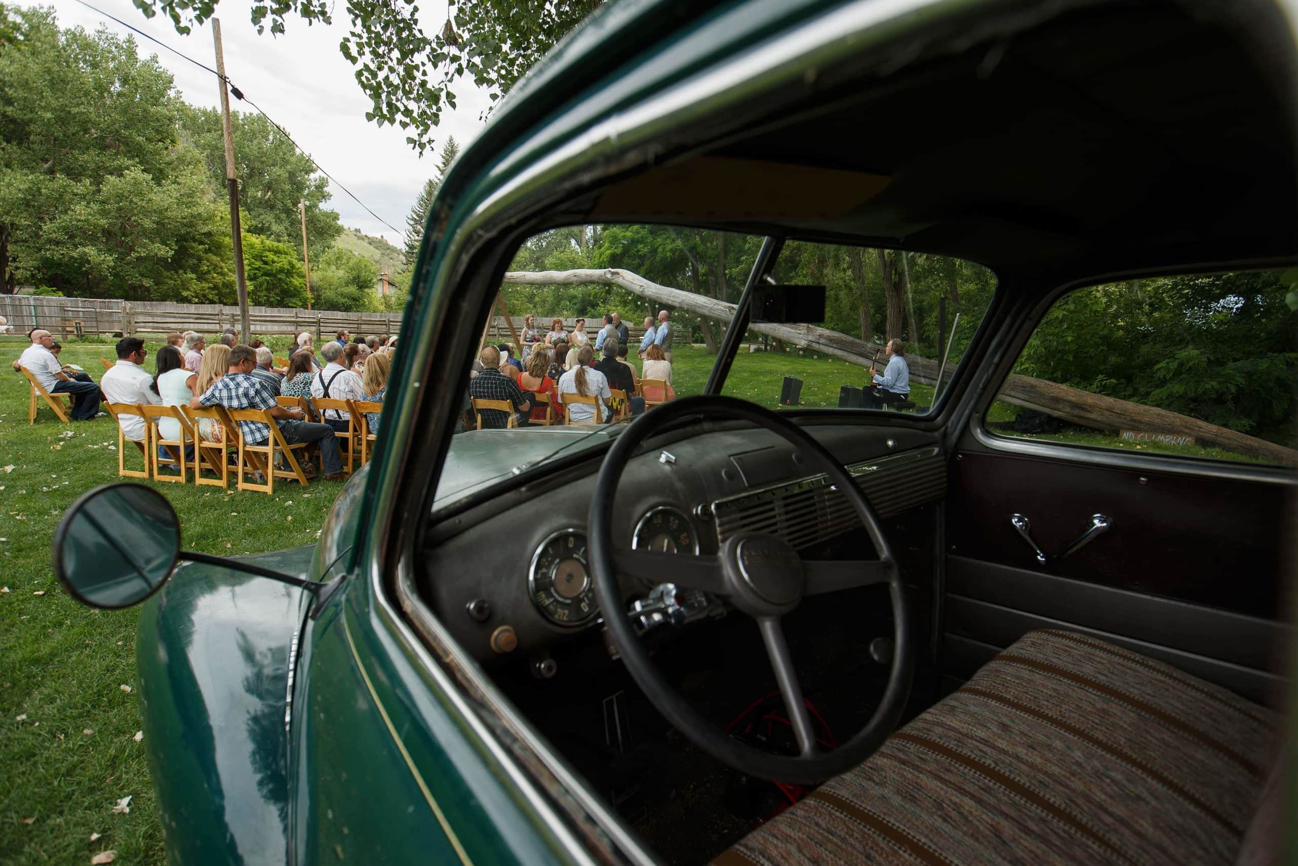 Vintage truck during a wedding ceremony at Lyons Farmette