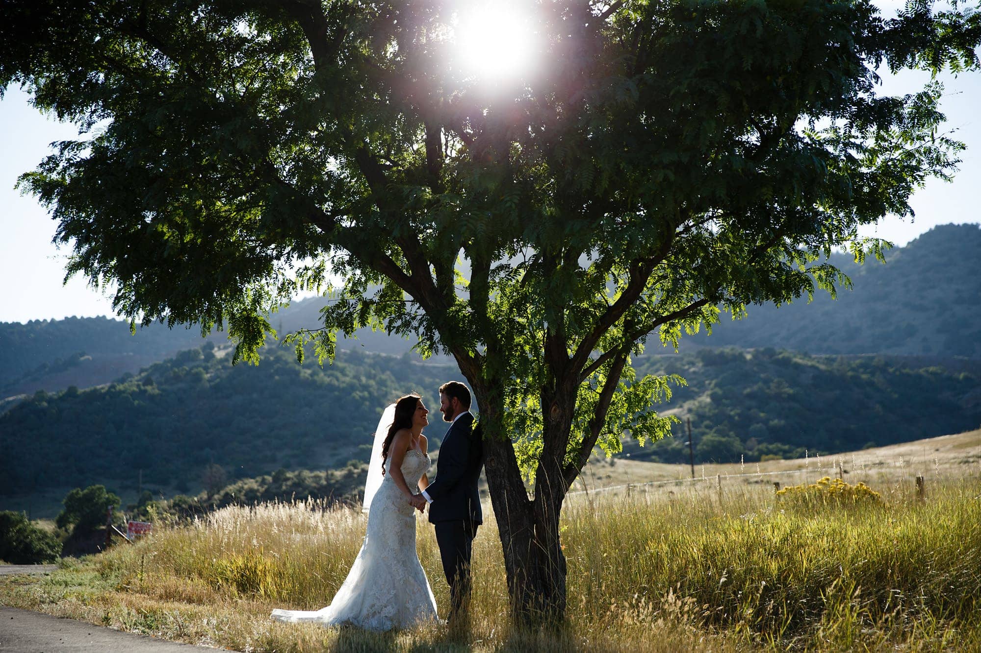Blake and Gina share a moment together after their wedding under a tree in Morrison, Colorado