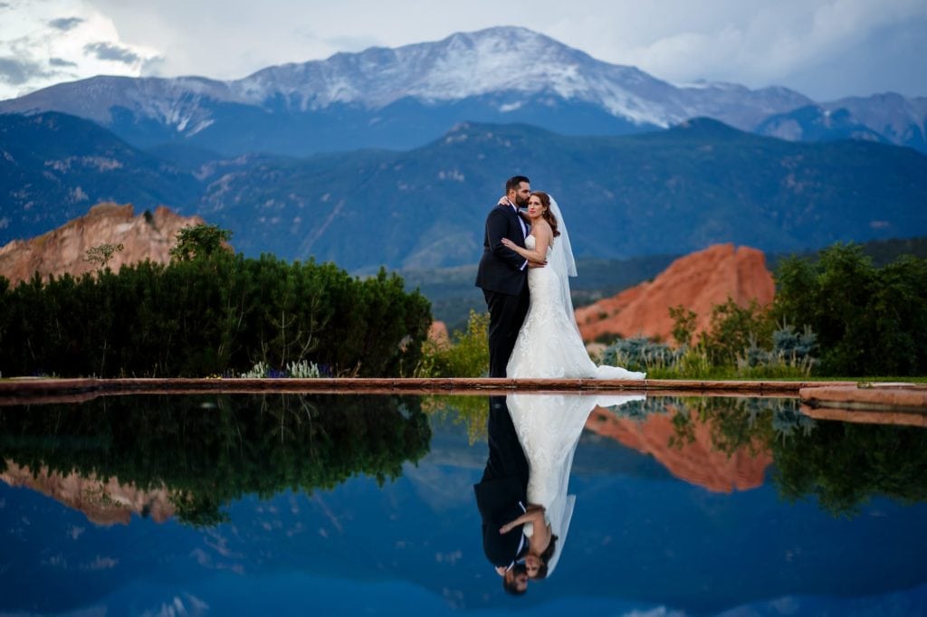 Wedding couple reflected in the pool at Garden of the Gods