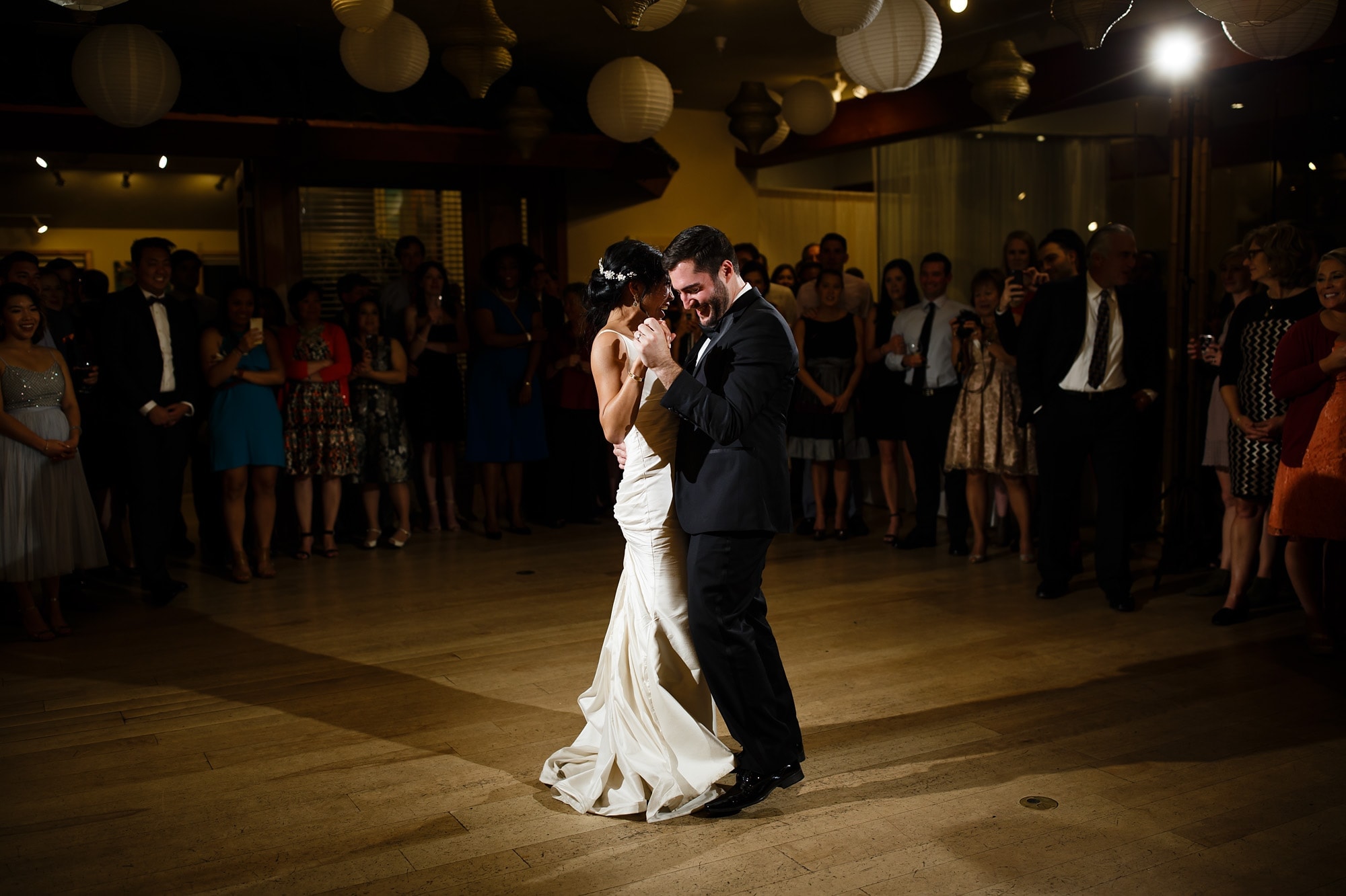 The bride and groom share their first dance on the third floor at Rembrandt Yard during their wedding reception