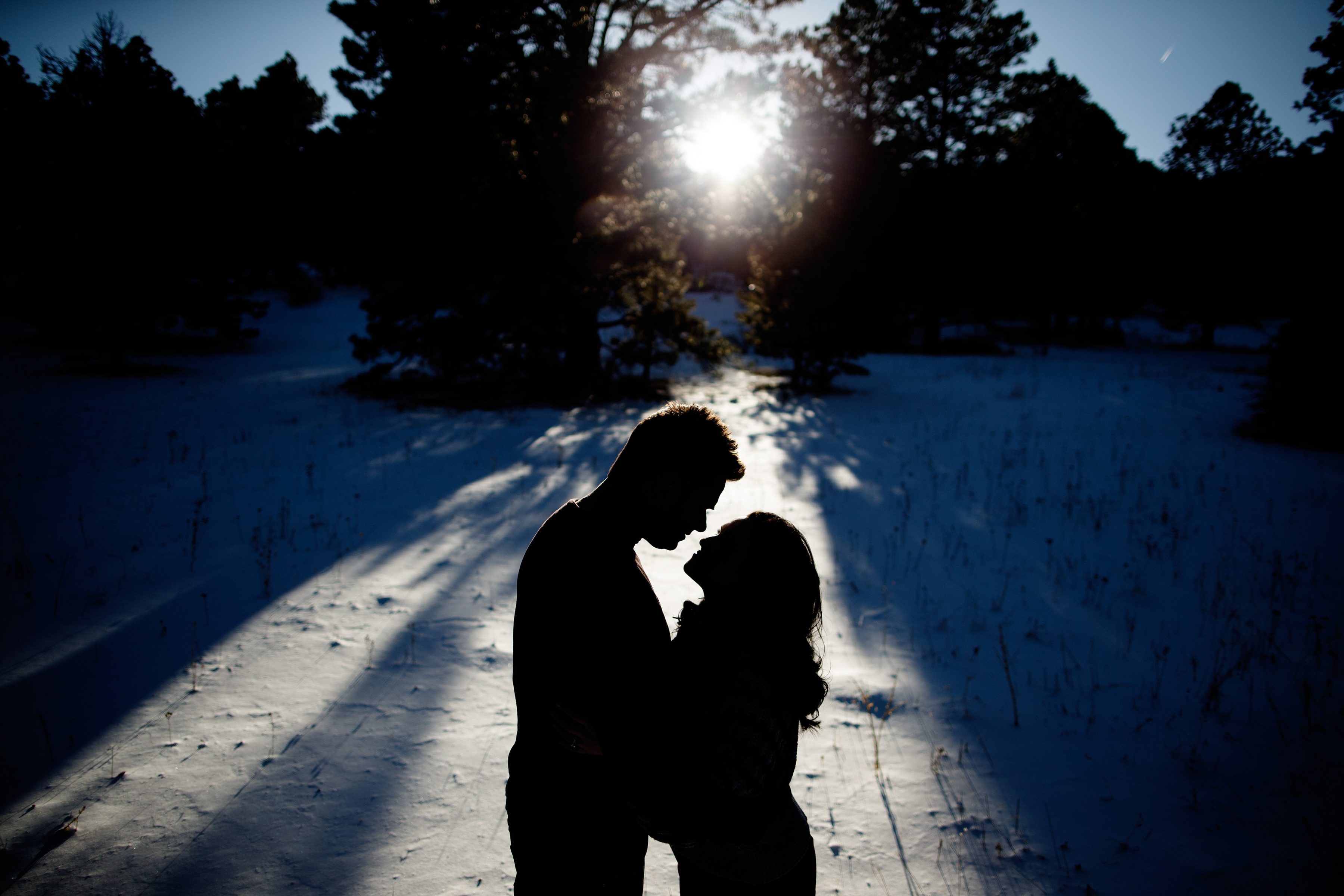 The sun casts shaddows in Elk Meadow Park as Melissa and Jordan pose together