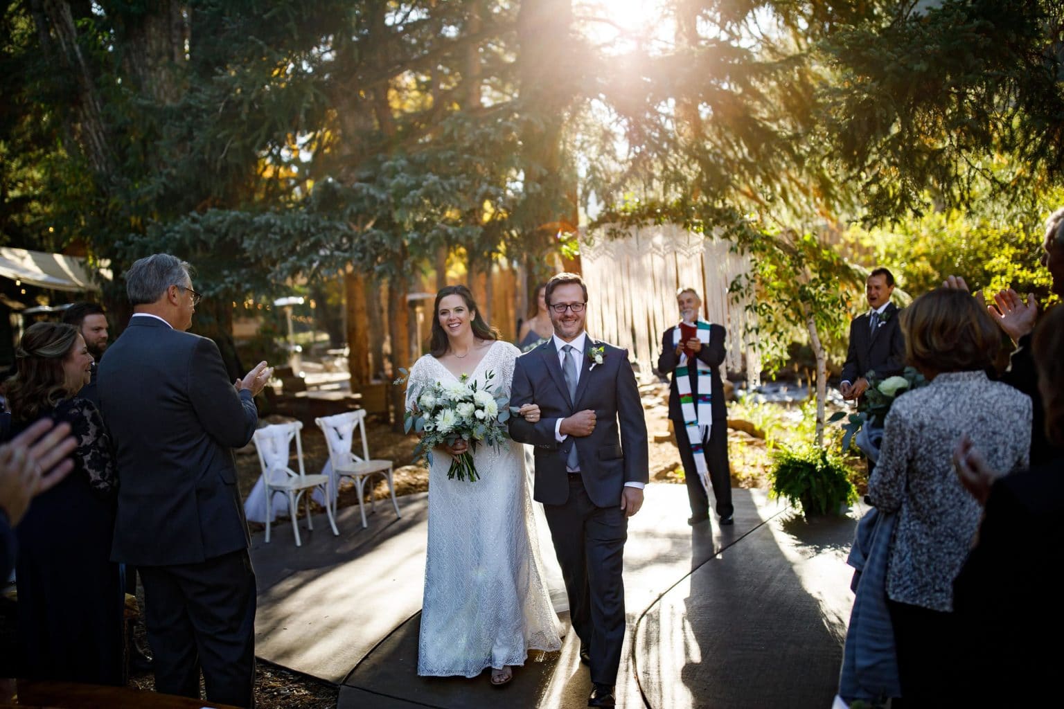Kate and Brian celebrate after their fall wedding ceremony at Blackstone Rivers Ranch