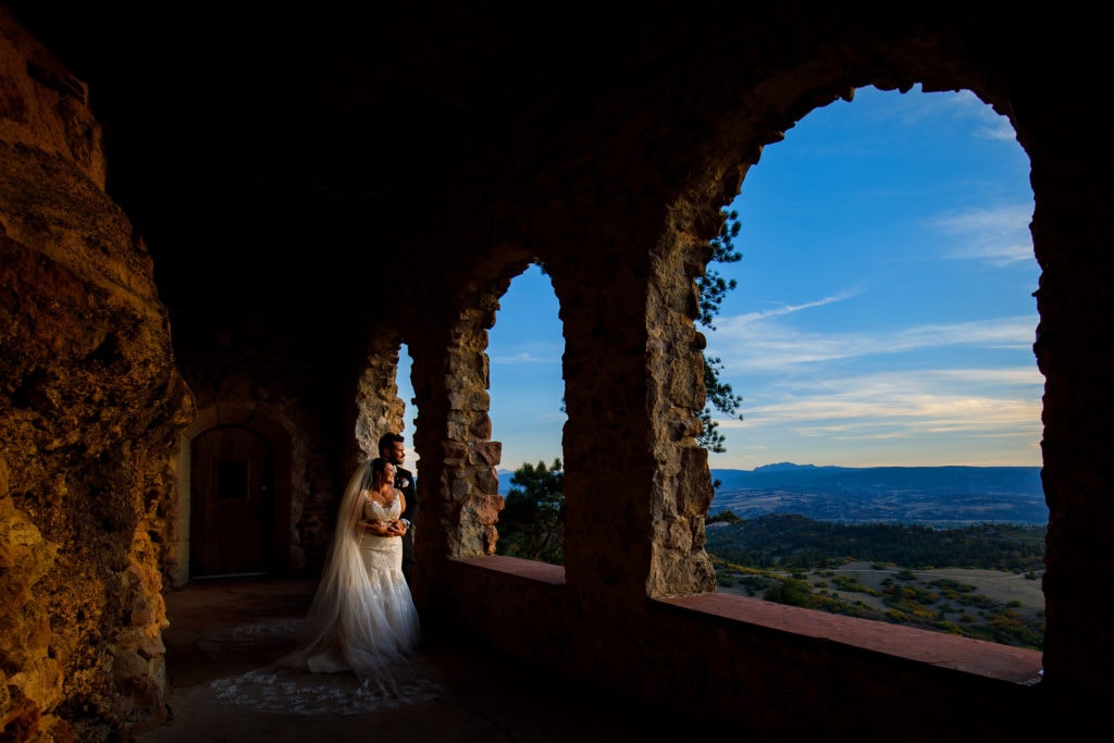 Melissa and Jordan pose during sunset following their Cherokee Ranch and Castle wedding in Sedalia