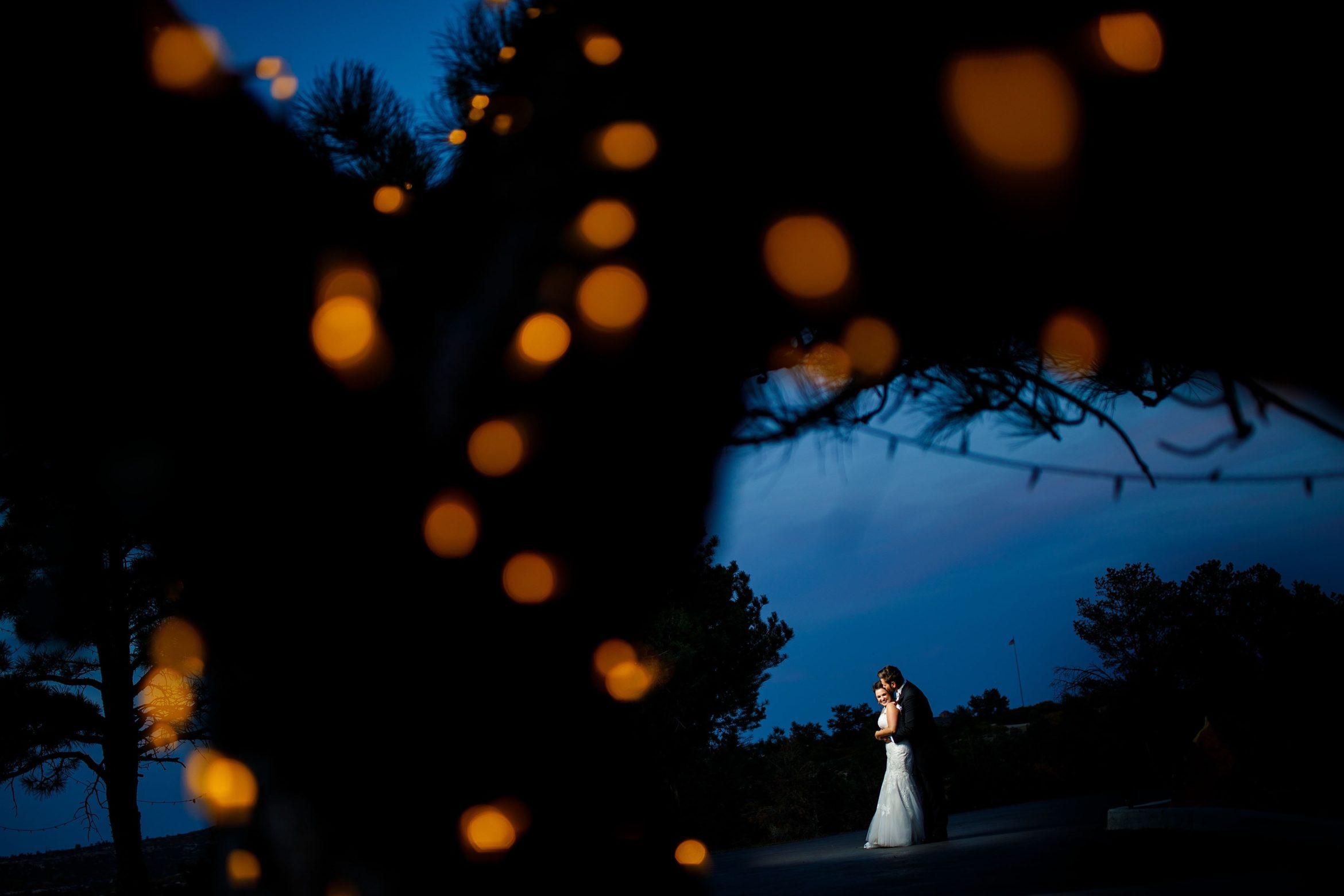 Melissa and Jordan pose together at dusk in Sedalia during their Cherokee Ranch and Castle wedding