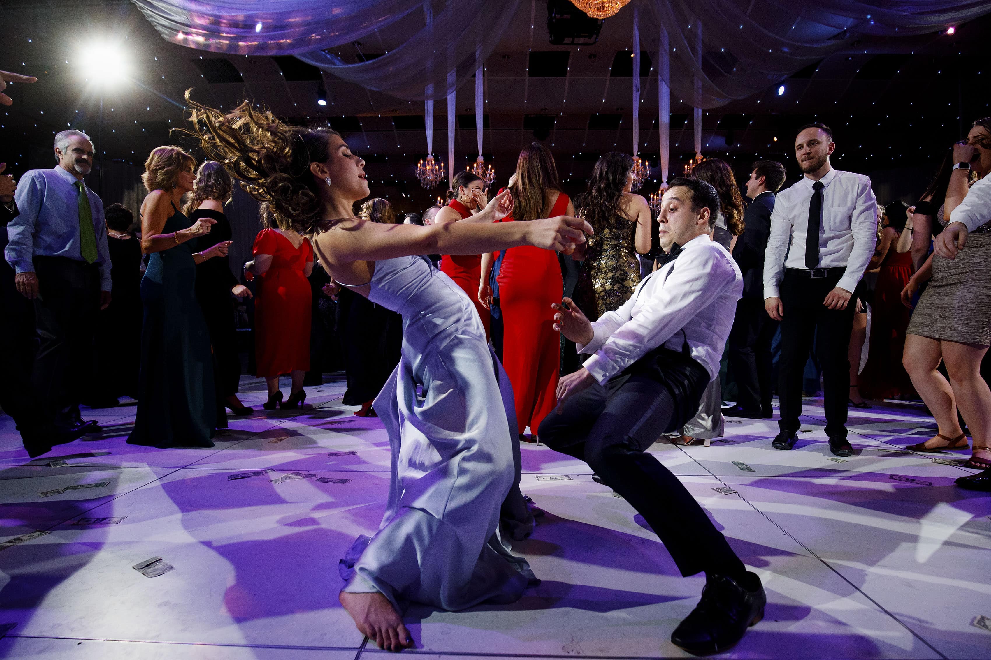 Guests dance during a wedding recetion at Seawell Ballroom