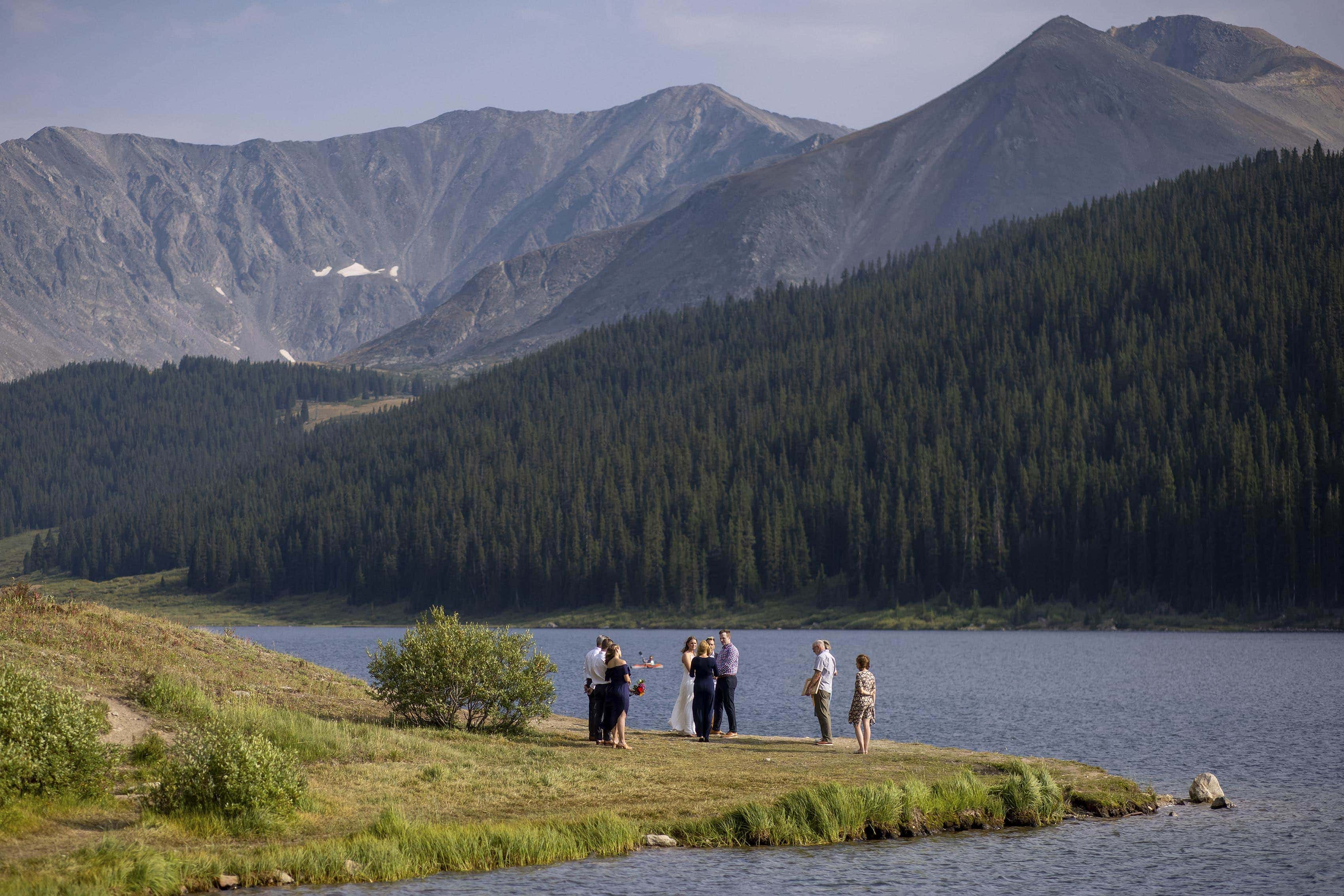 A small wedding ceremony takes place at Clinton Gulch Dam Reservoir near Leadville, CO for Mel and Drew