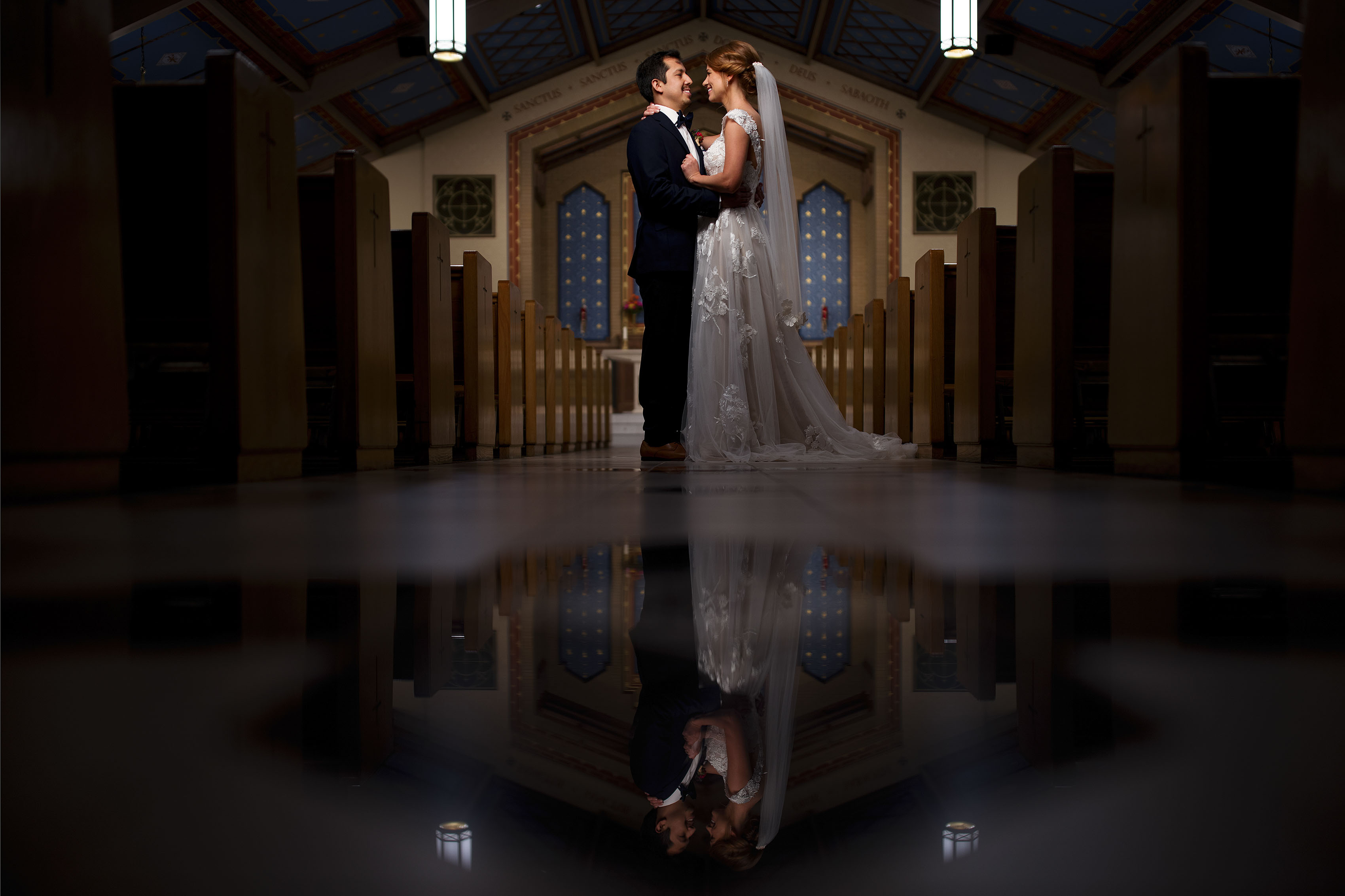 newlyweds pose for a portrait at Holy Name Catholic Church