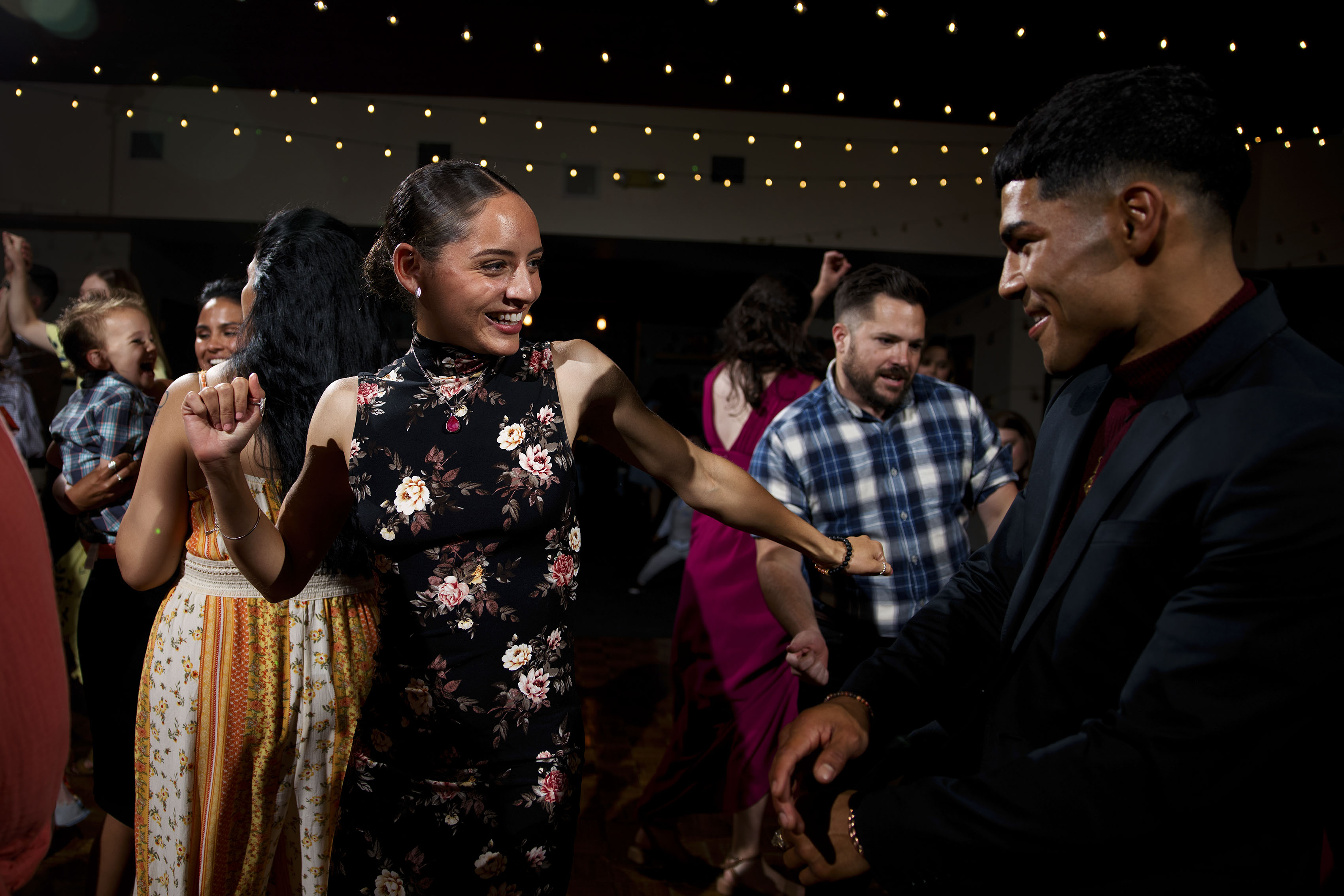 guests dance during a wedding reception at Holy Name Catholic Church