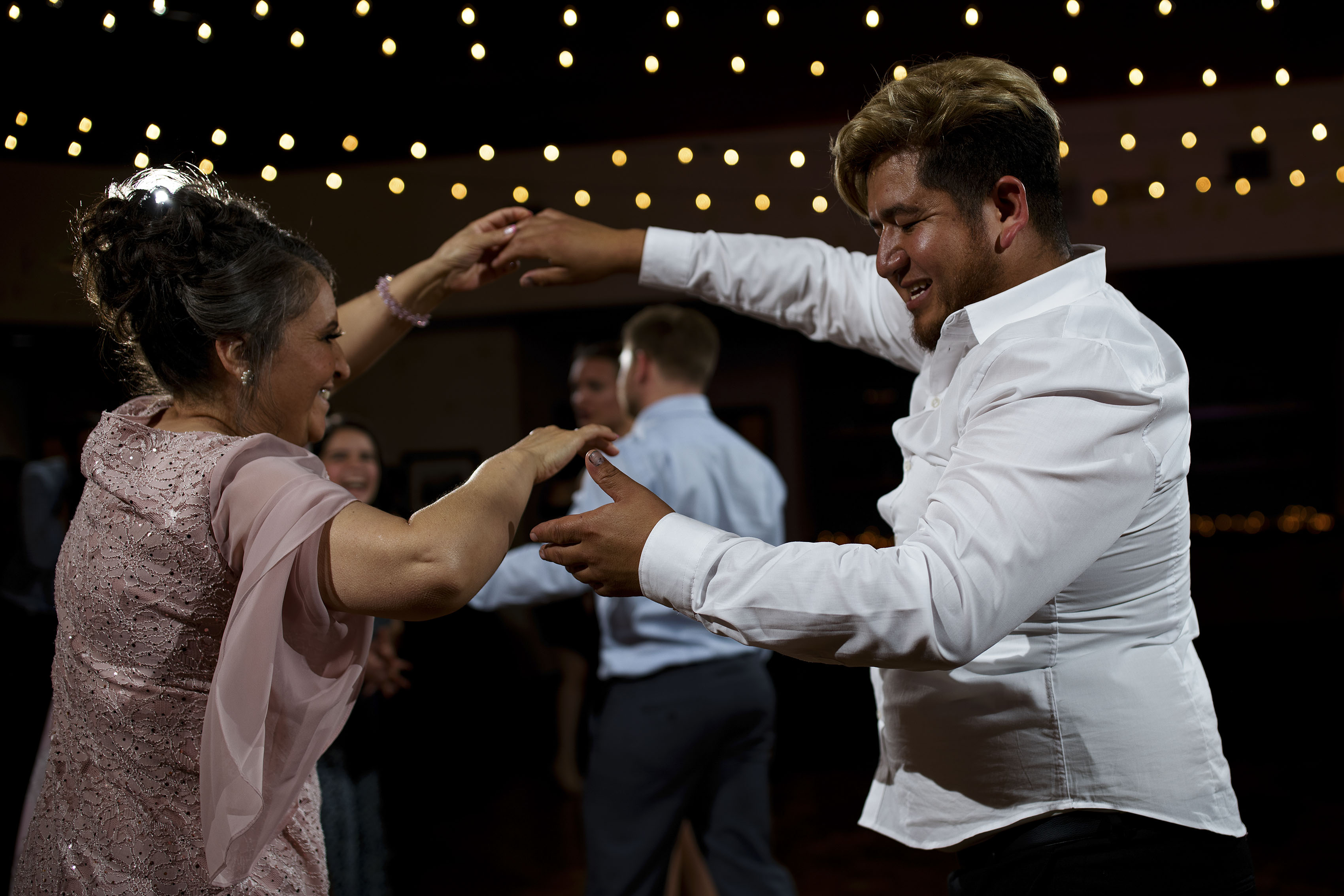 guests dance during a wedding reception at Holy Name Catholic Church