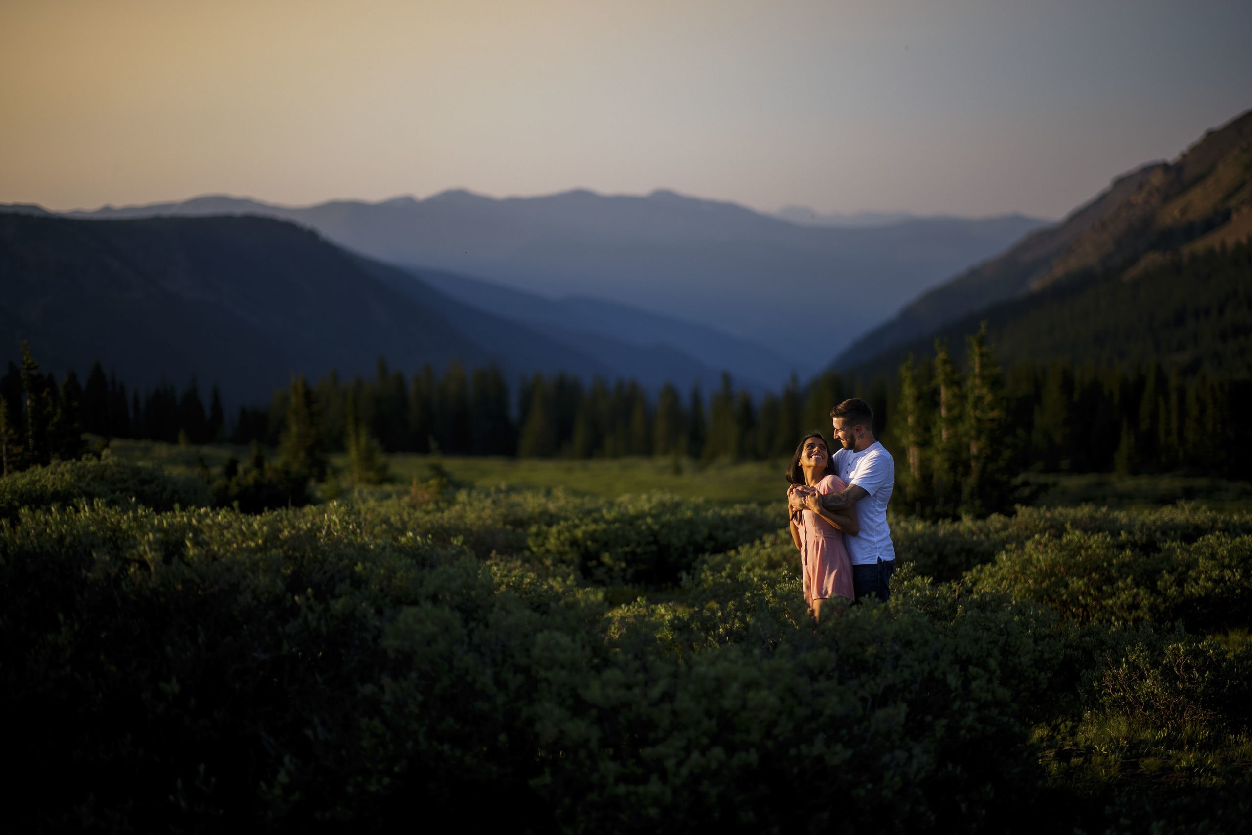 A newly engaged couple share a moment on Guanella Pass
