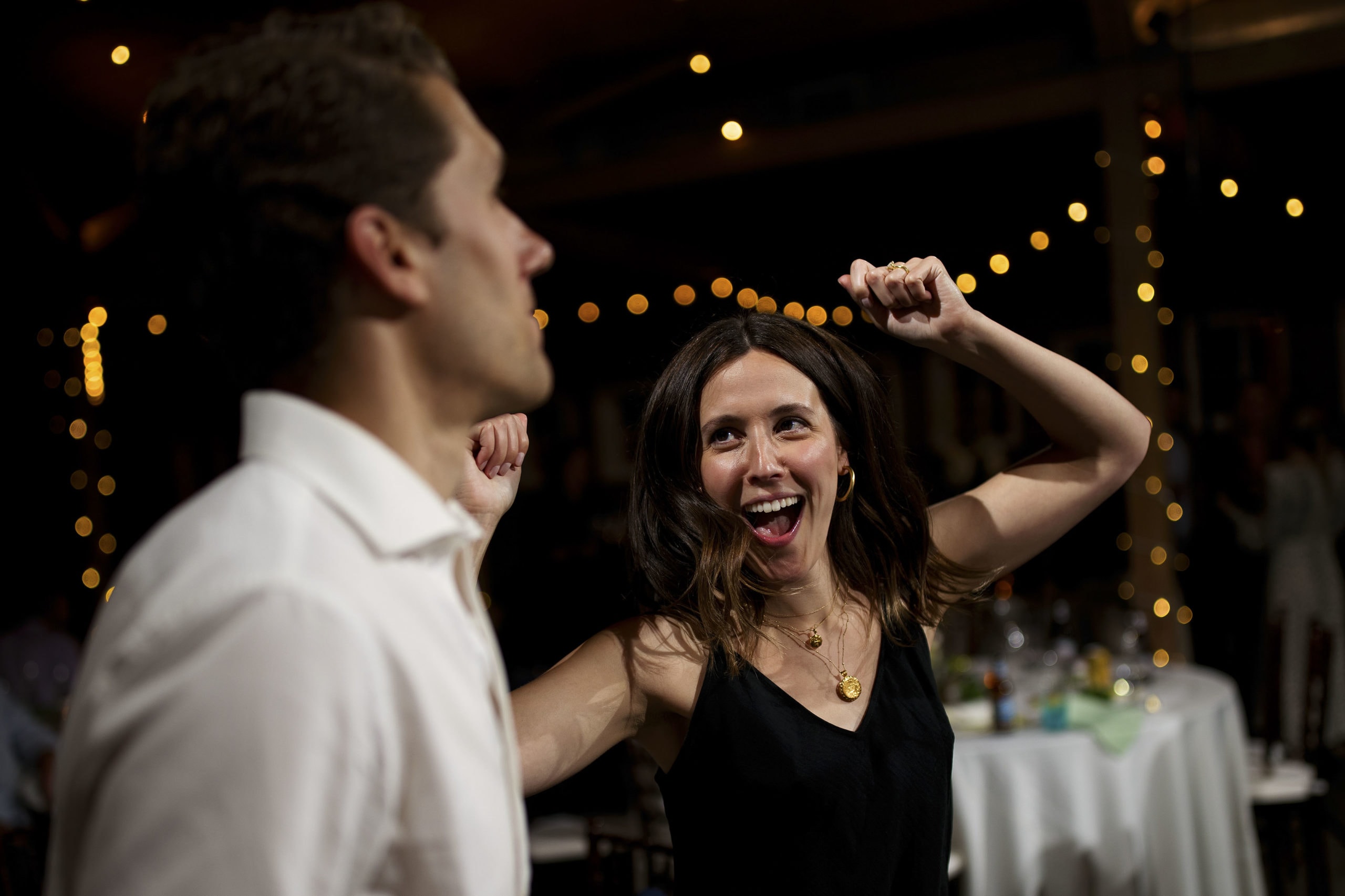 guests dance during a wedding reception at the barn at raccoon creek