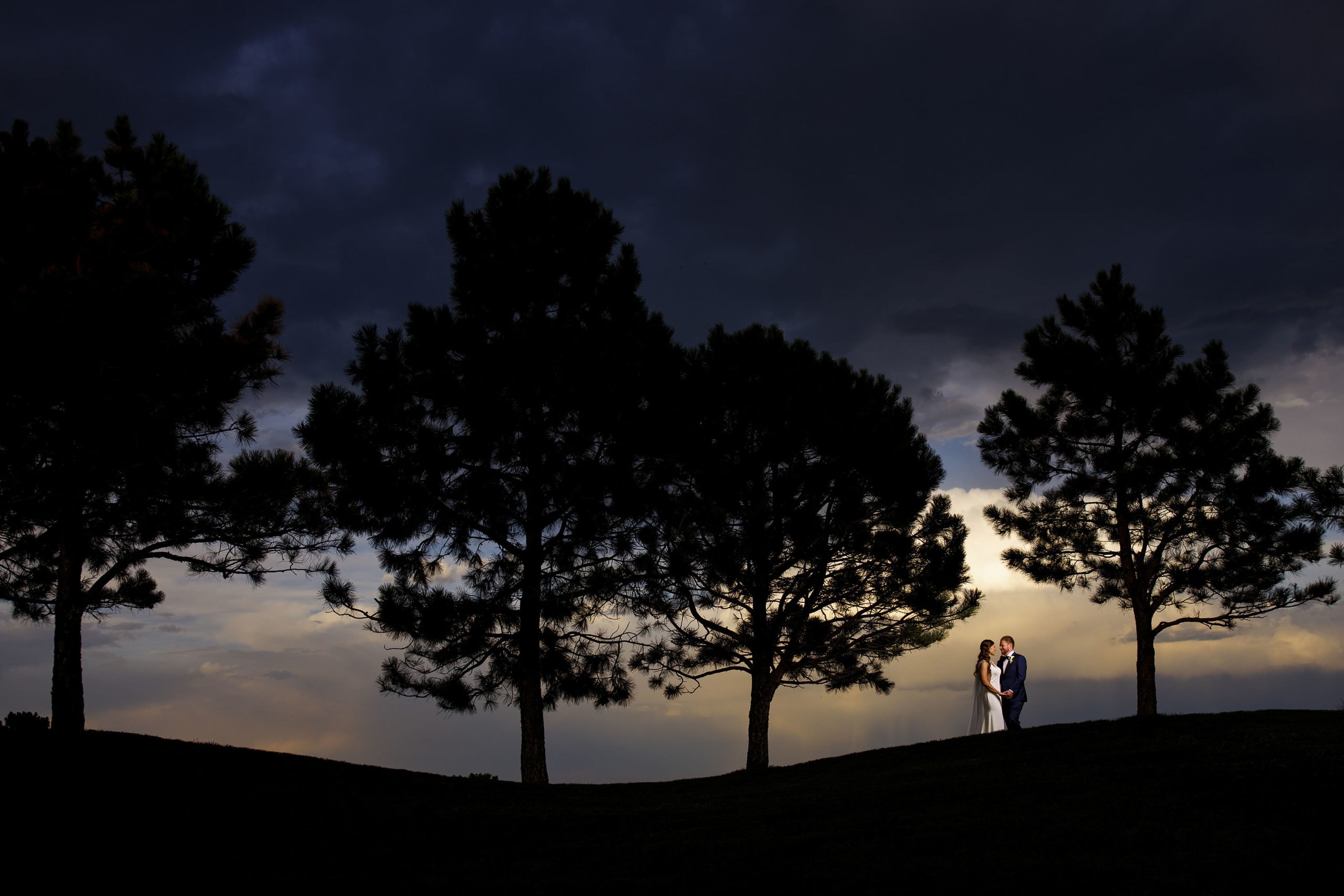 The newlyweds pose during sunset at Sanctuary Golf Course