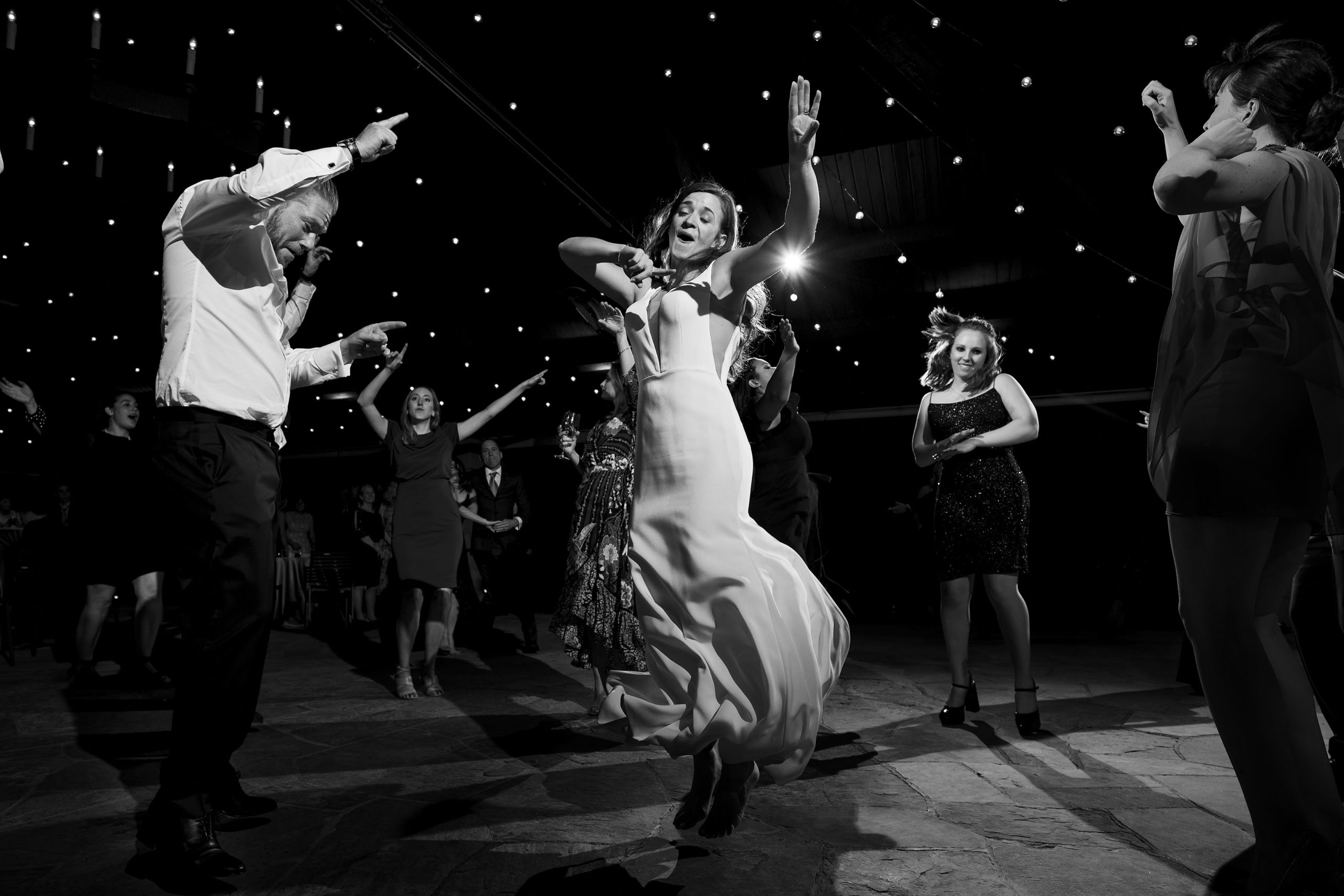 The bride, groom and guests dance during a wedding reception at Sanctuary