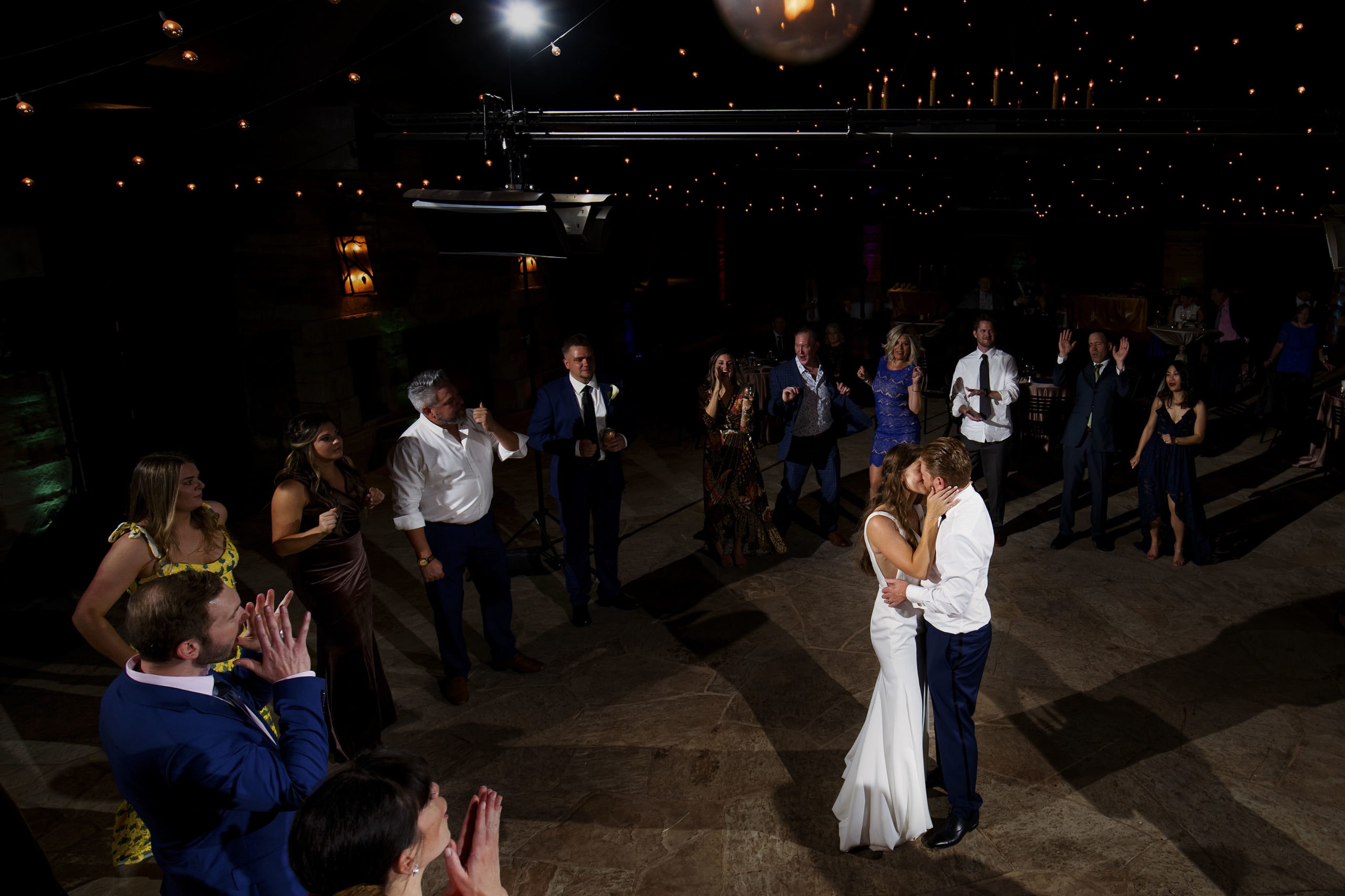 The couple share a kiss on the dance floor during their wedding at Sanctuary Golf Course