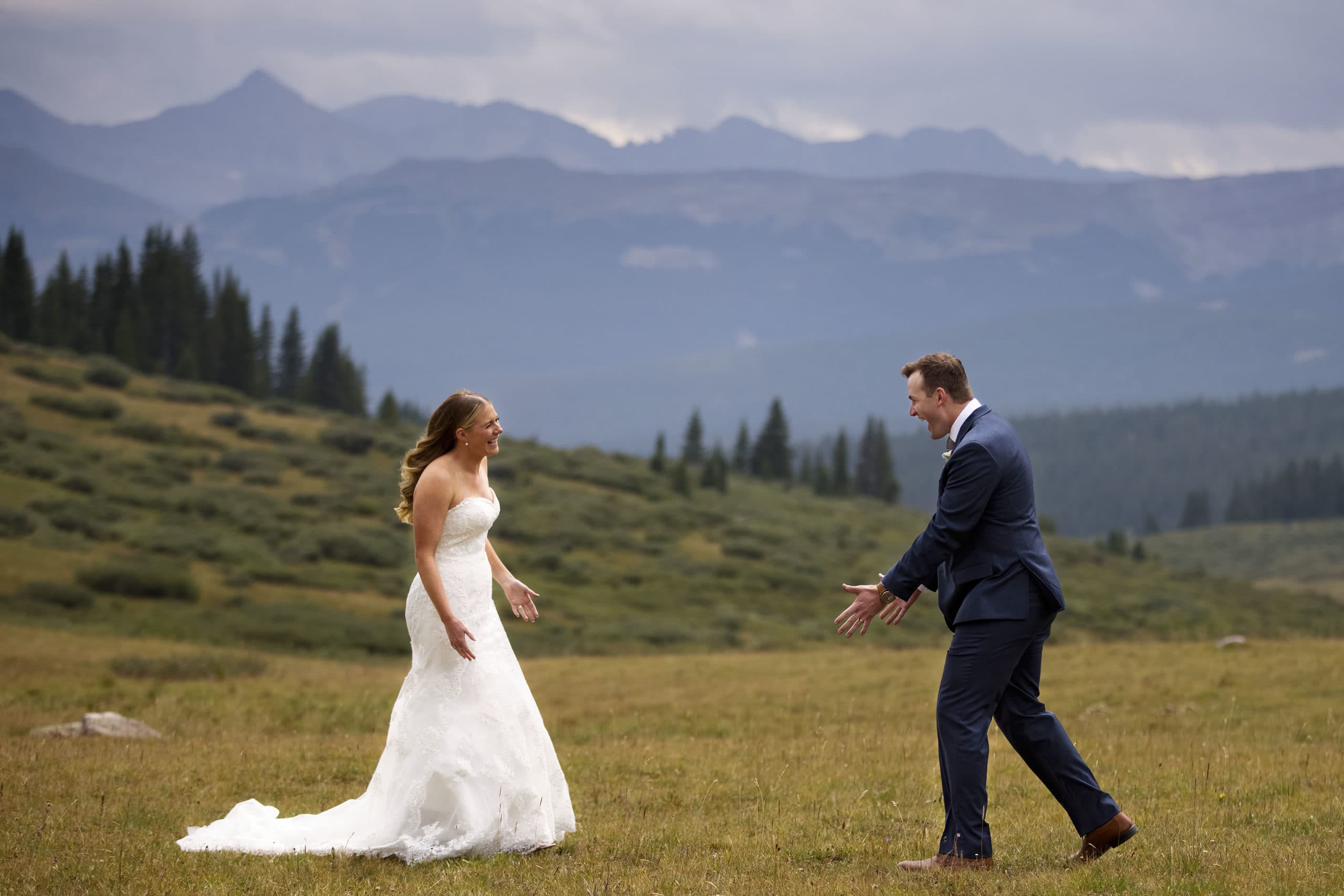 Drew and Mel react during their first look on Shrine Pass during their wedding day