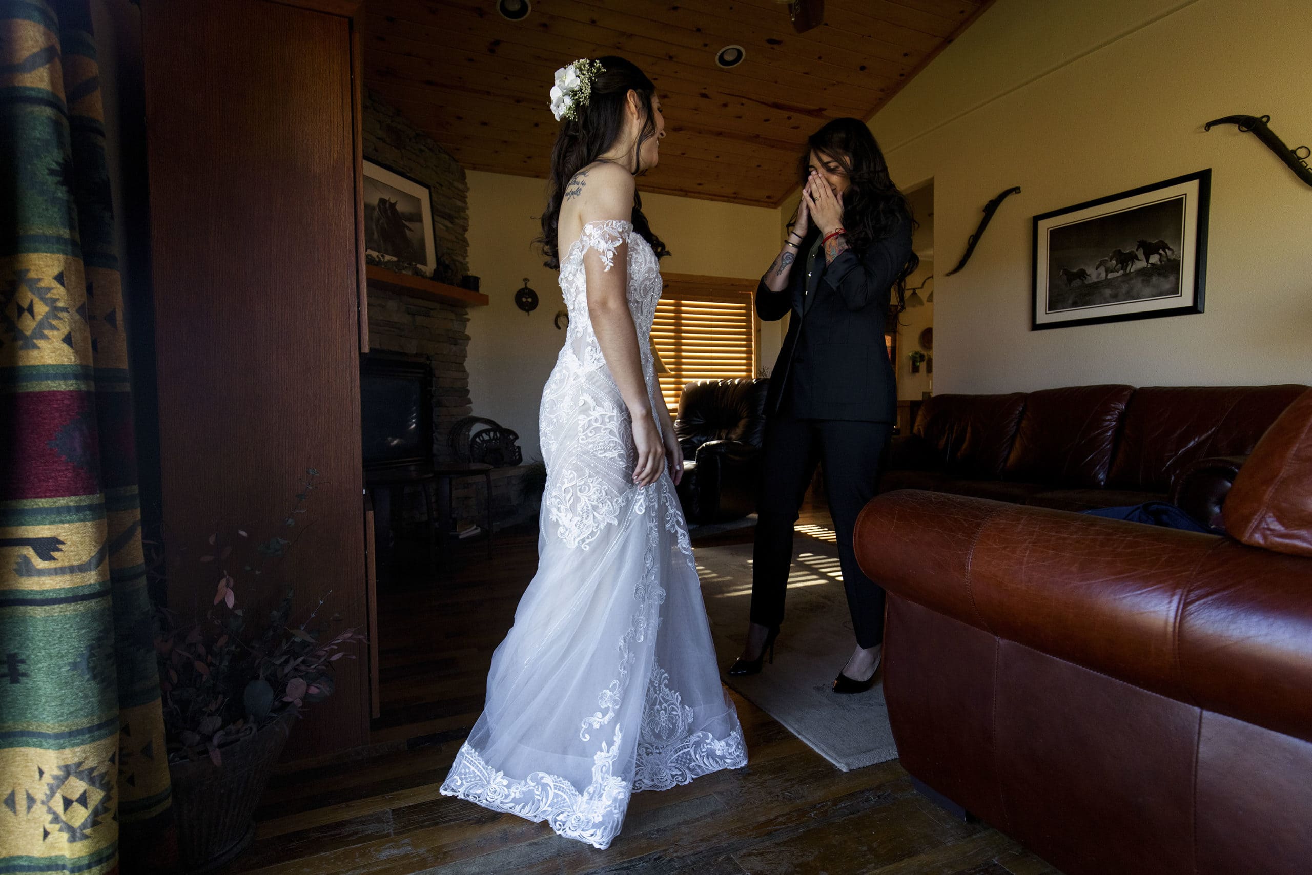 The bride’s friend reacts to seeing her in her wedding dress