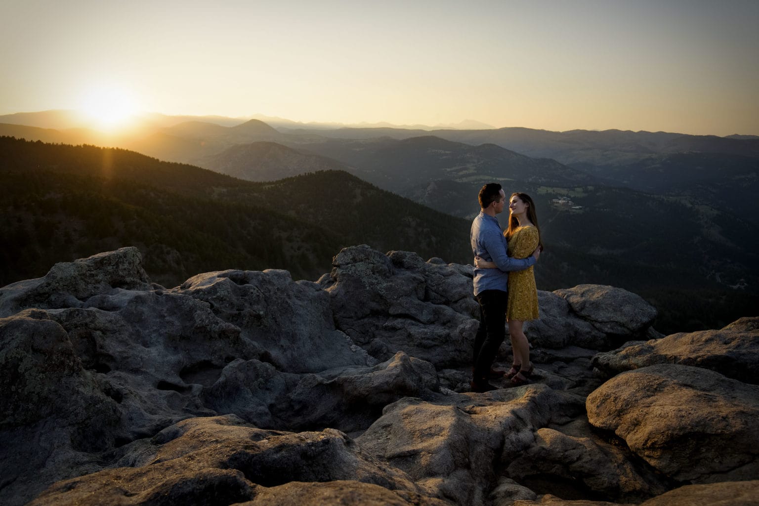 Melanie and Colin share a moment at sunset at Lost Gulch Overlook in Boulder County