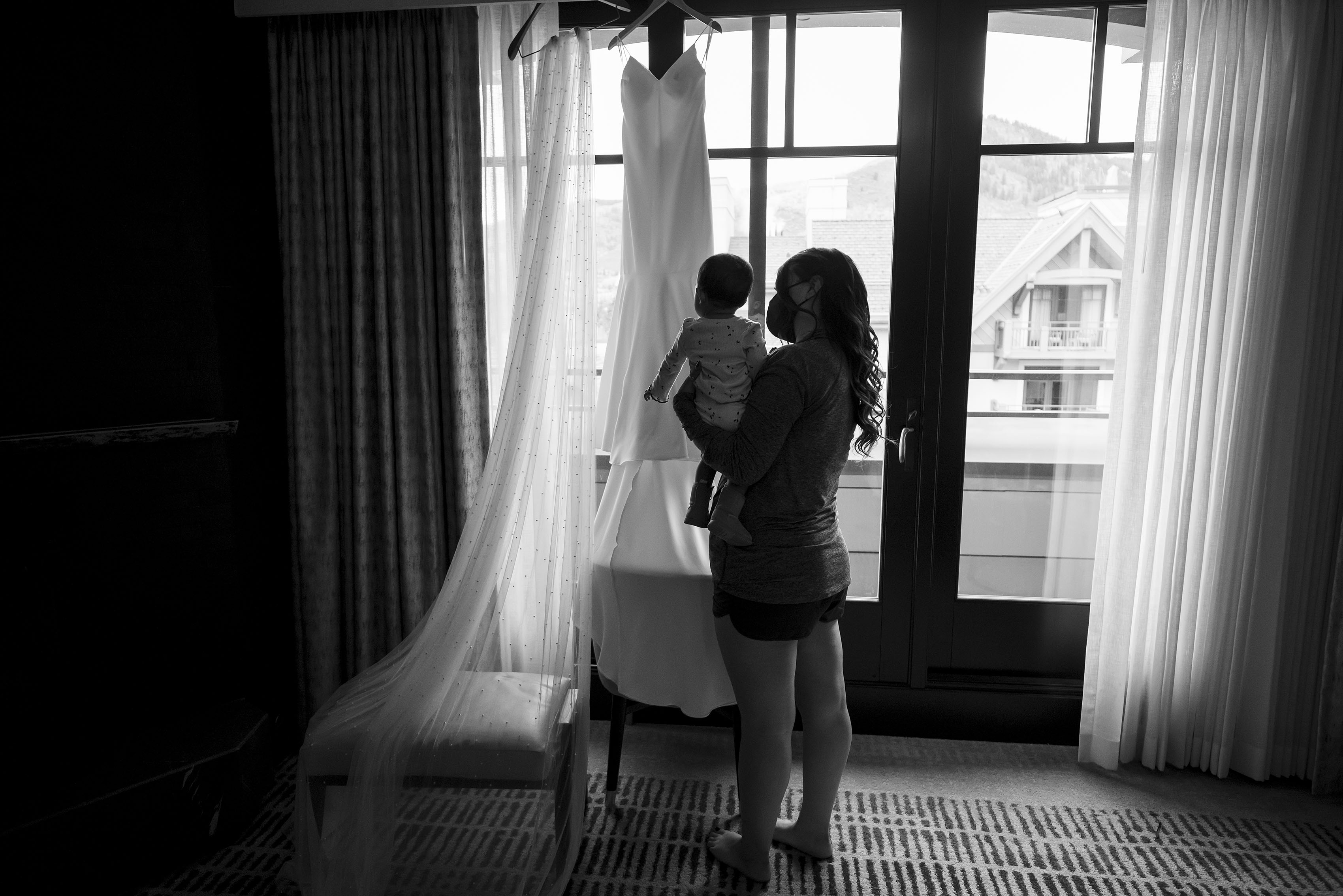 The bride's niece admires the wedding dress on the wedding day