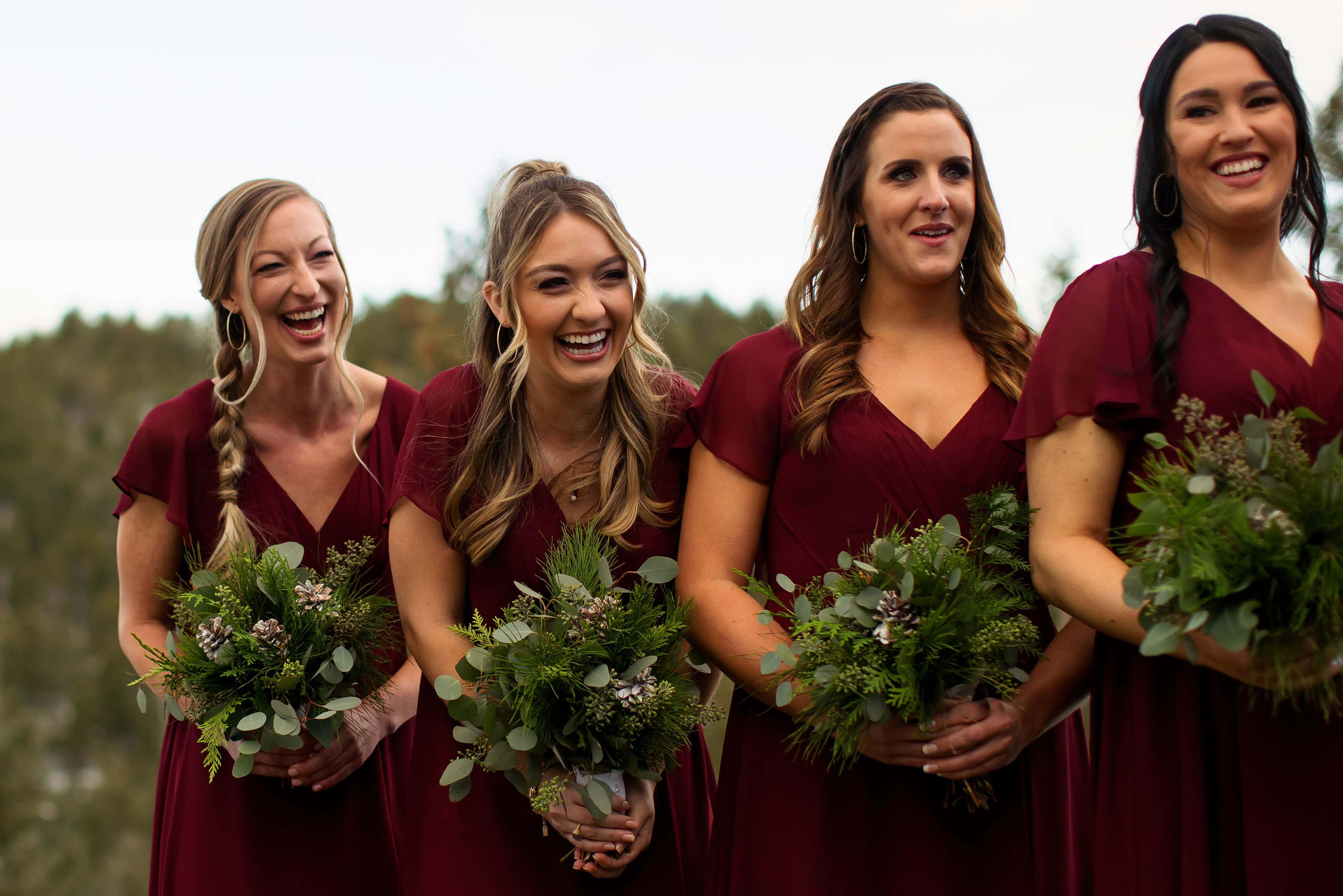 Bridesmaids laugh during the ceremony