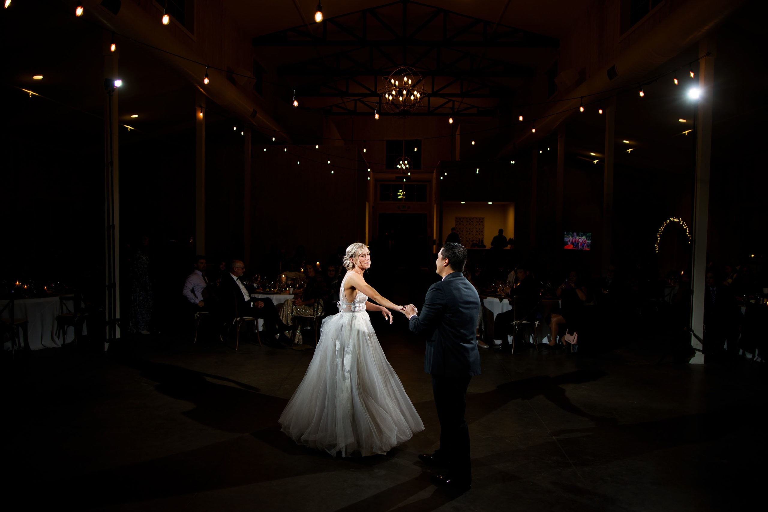 The newlyweds share their first dance at Woodlands in Morrison, Colorado