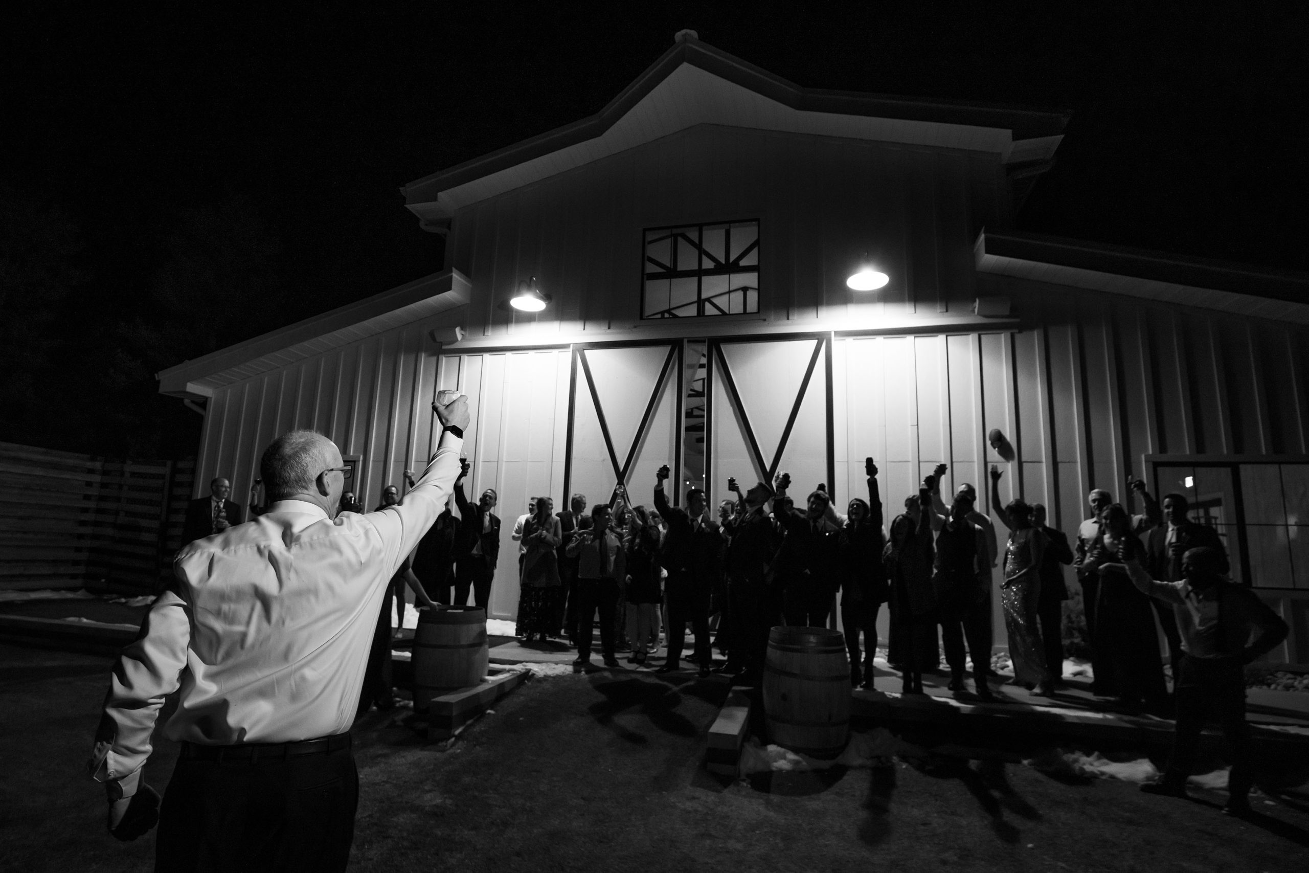 The father of the bride gives a moonlight toast outside of Woodlands wedding venue during the reception