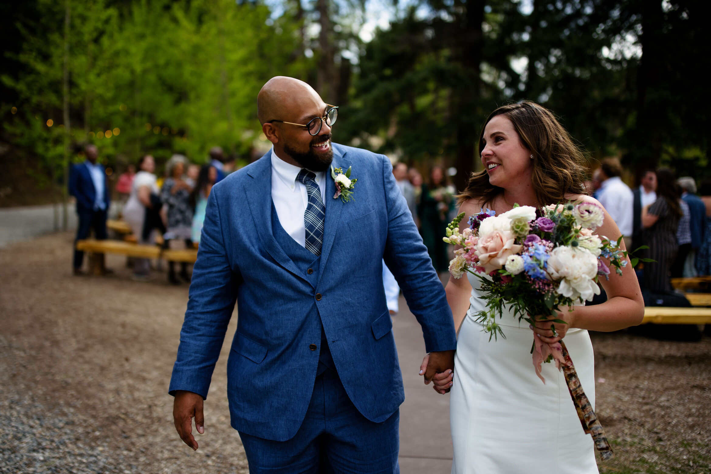 Lauren and Stanley celebrate after their wedding ceremony at Blackstone Rivers Ranch