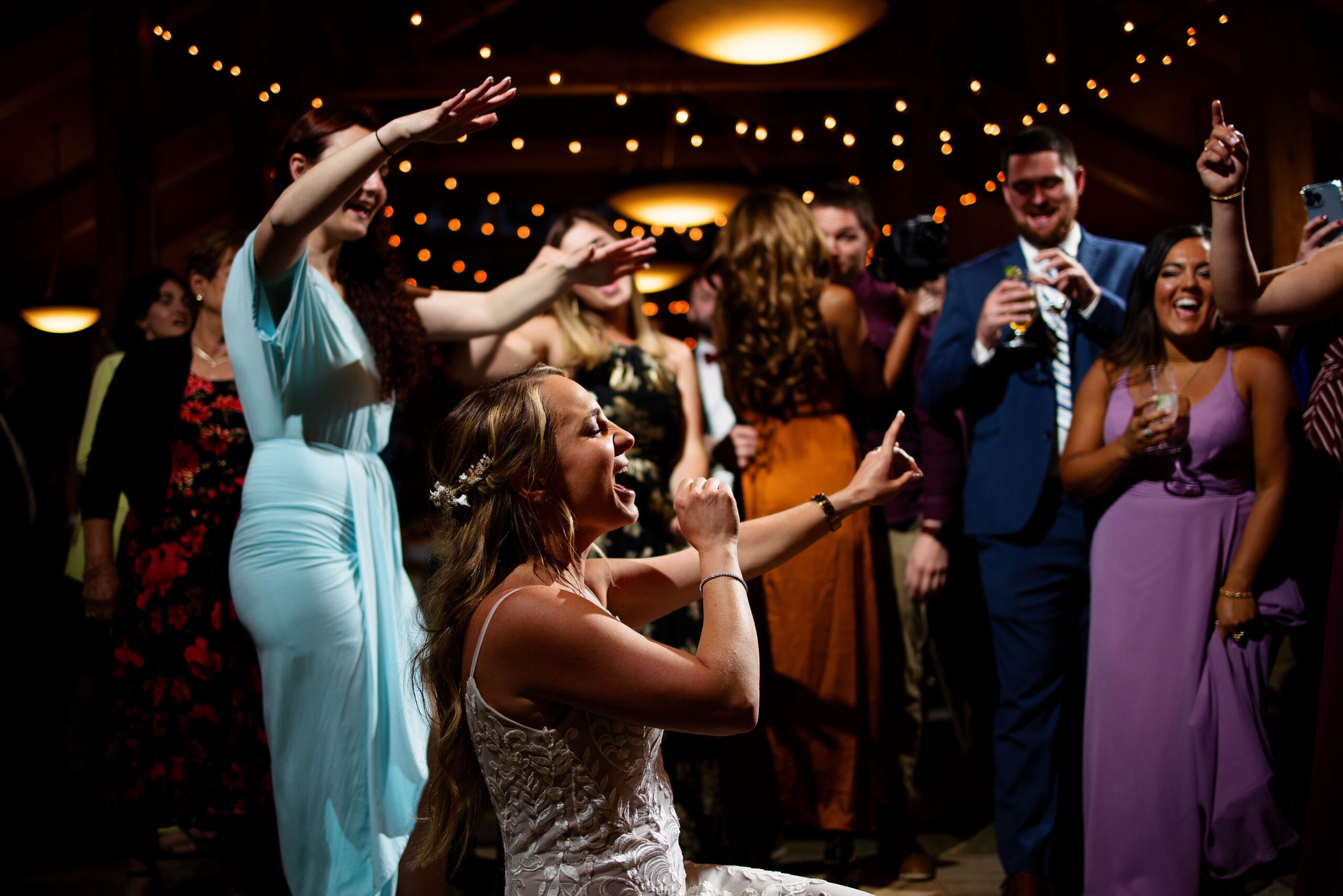 Guests dance during a wedding reception at Black Mountain Lodge