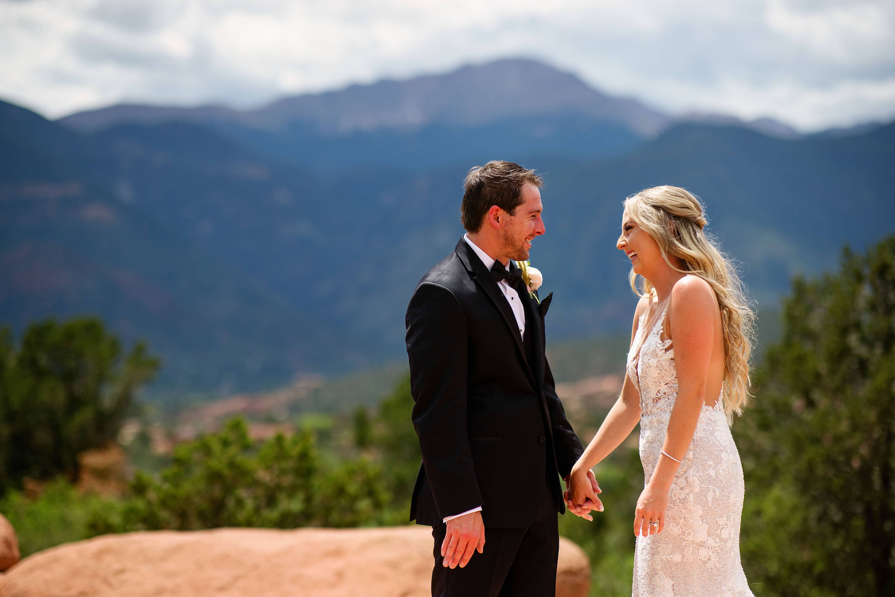 A couple laughs together in Colorado Springs on their wedding day