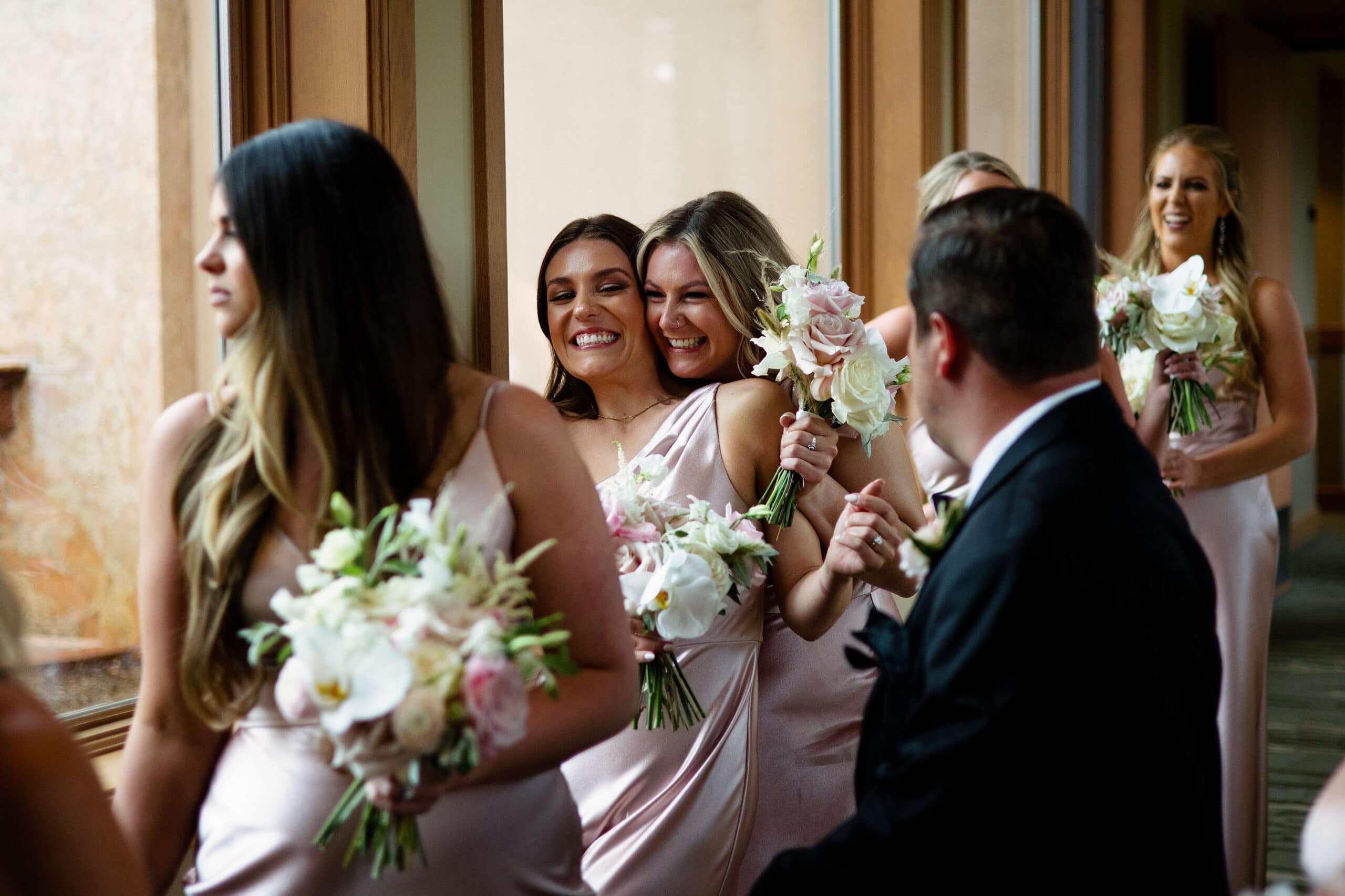 Bridesmaids laugh before the ceremony