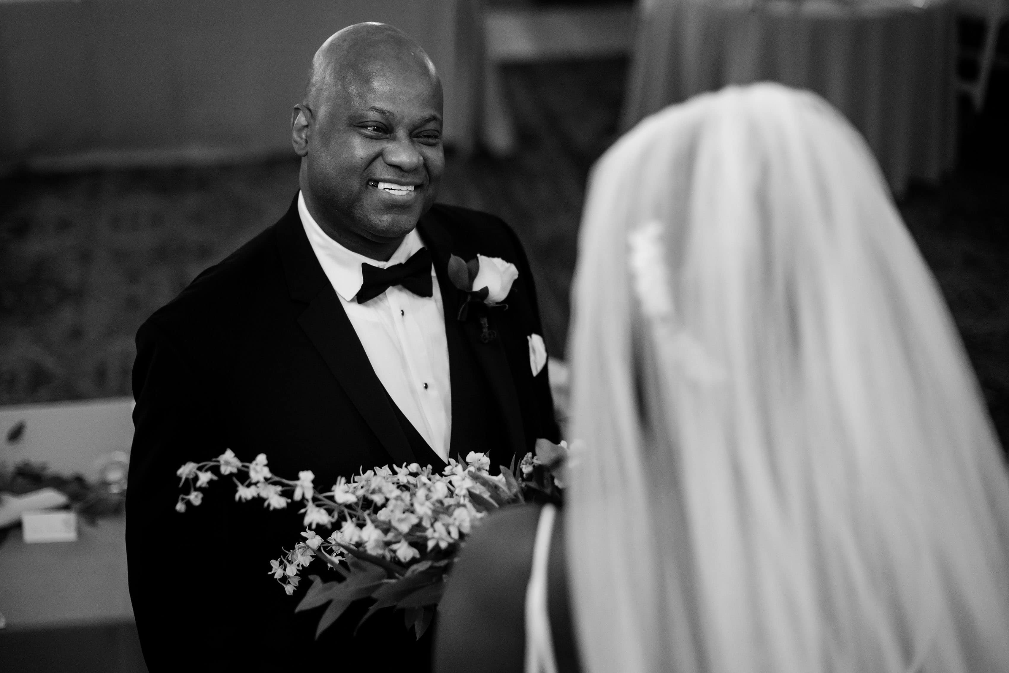 The bride’s father sees her for the first time on the wedding day
