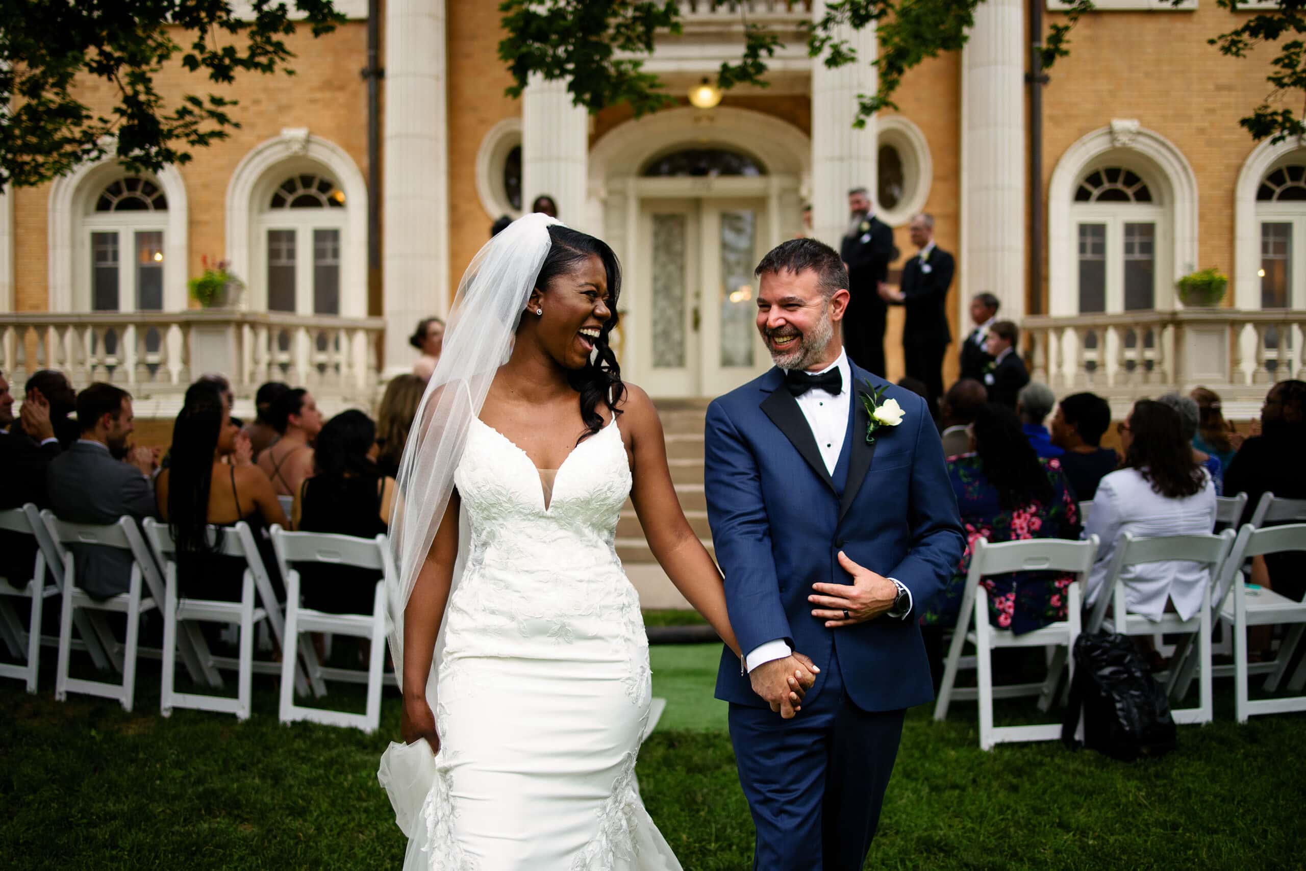 The couple celebrates as they walk down the aisle at Grany Humphrey’s Mansion