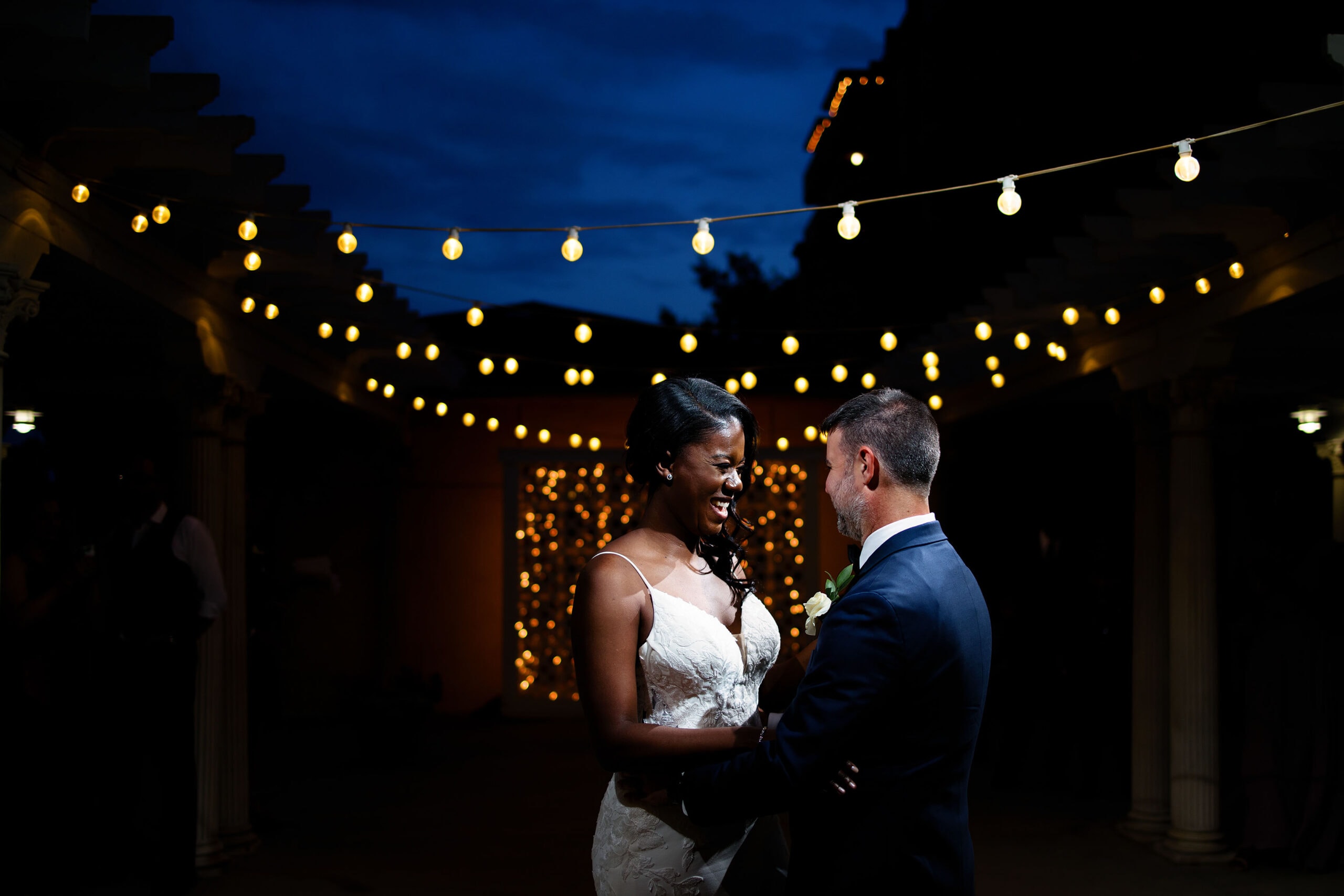 Aisha and Shad share their first dance under the market lights on the patio at Grant Humphrey’s Mansion
