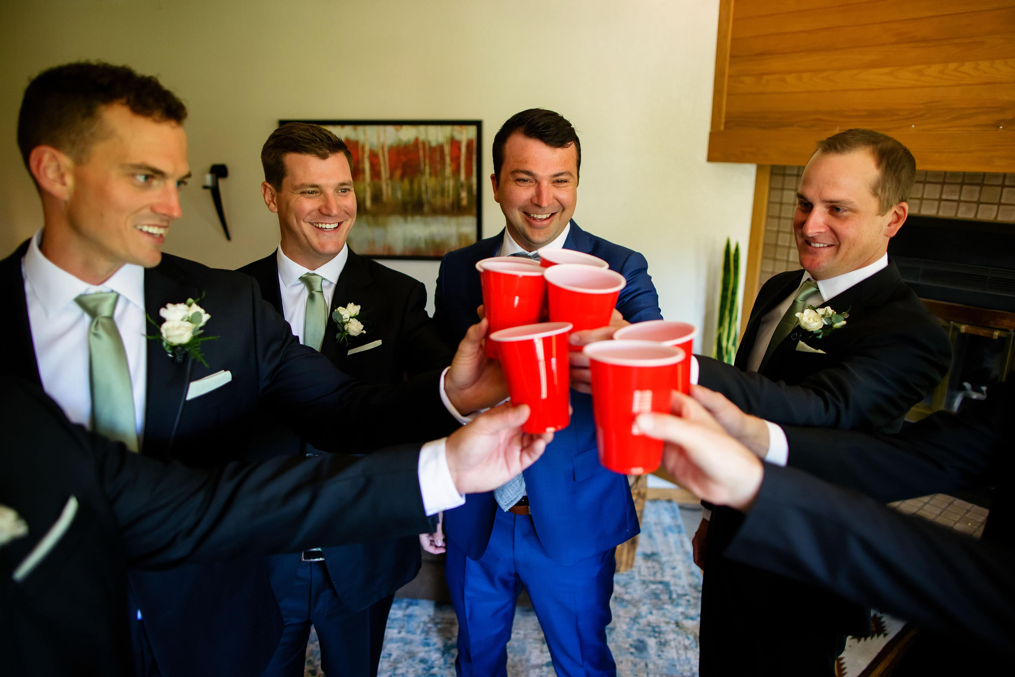 The groom toasts tequila with groomsmen