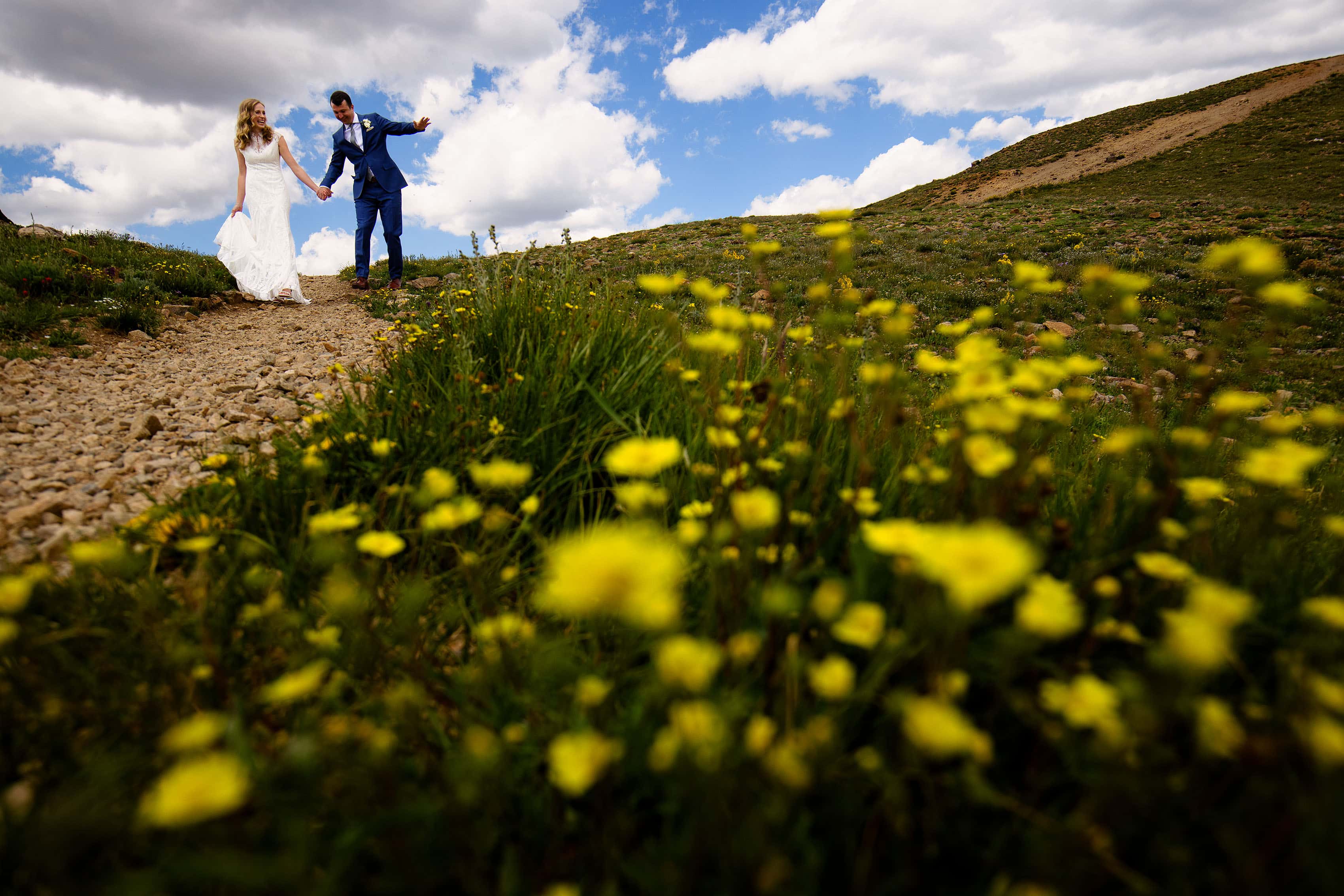 Steven looses his footing while walking down a slope with Keely on Loveland Pass