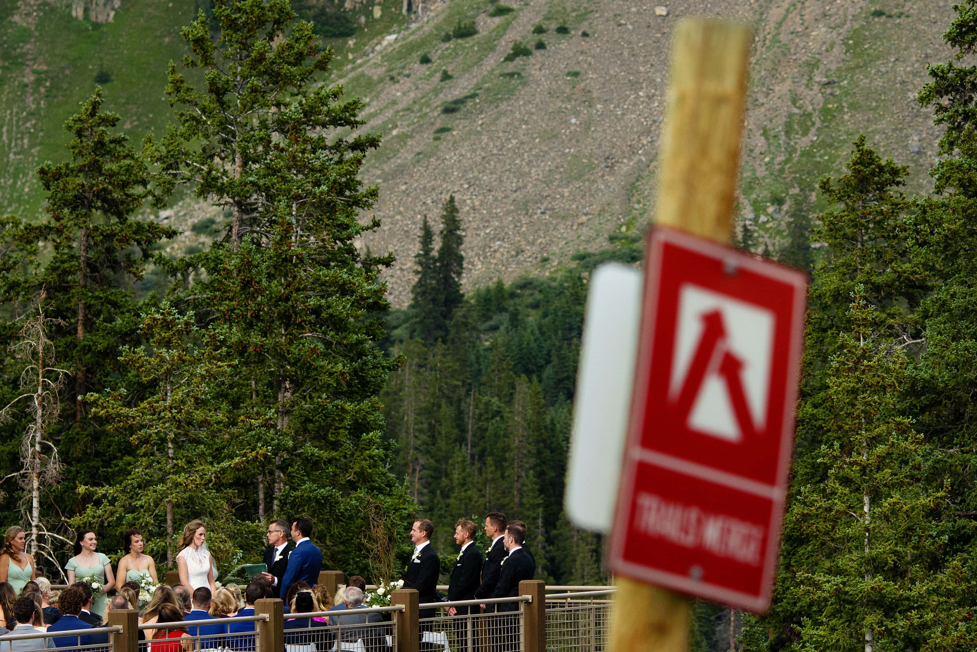 A trails merge sign near the wedding ceremony
