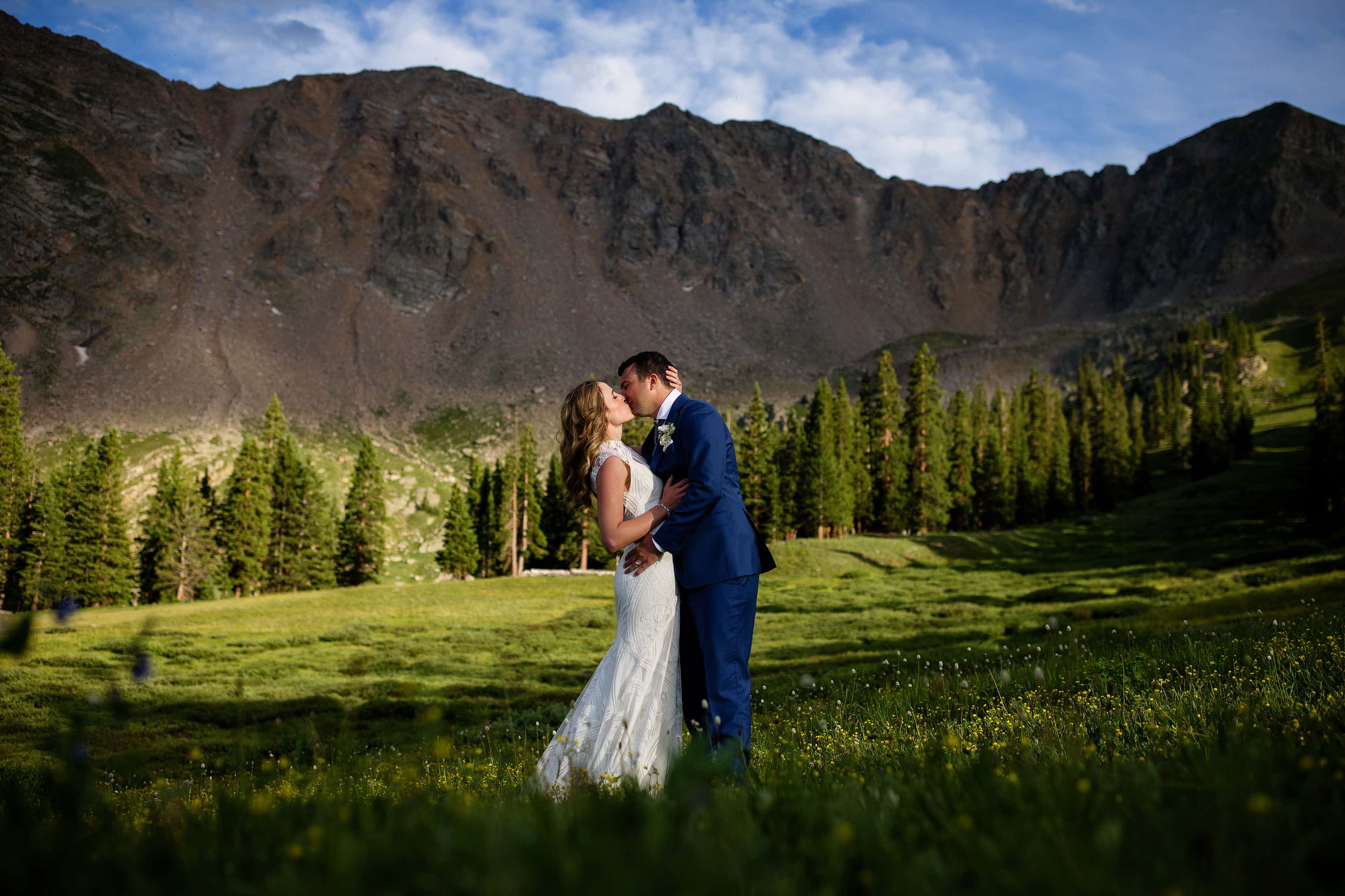 Keely and Steven share a kiss in the meadow near the East Wall at Arapahoe Basin