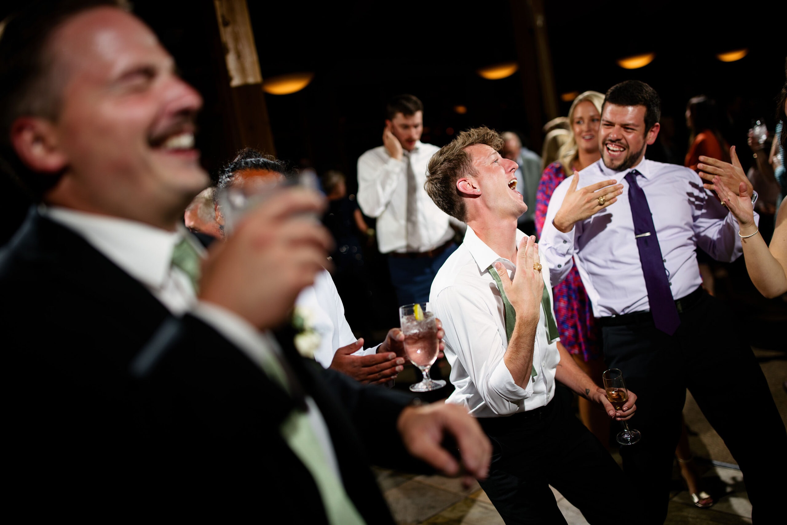 Guests dance during a wedding reception at Black Mountain Lodge