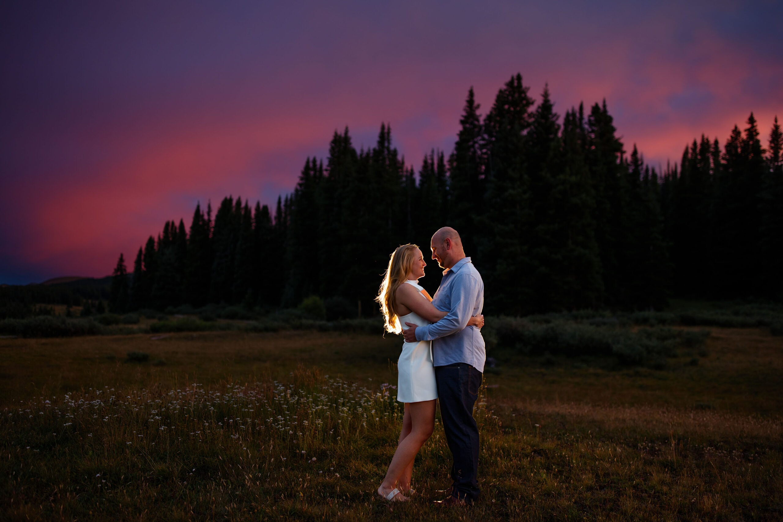 Cassy and David Pose on Shrine Pass during their sunset engagement session