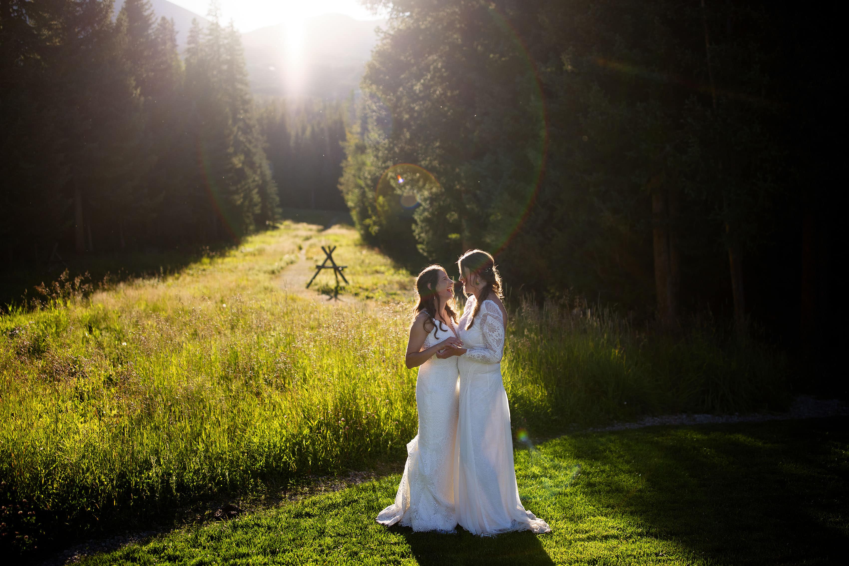 The newlyweds pose near a meadow in Breckenridge