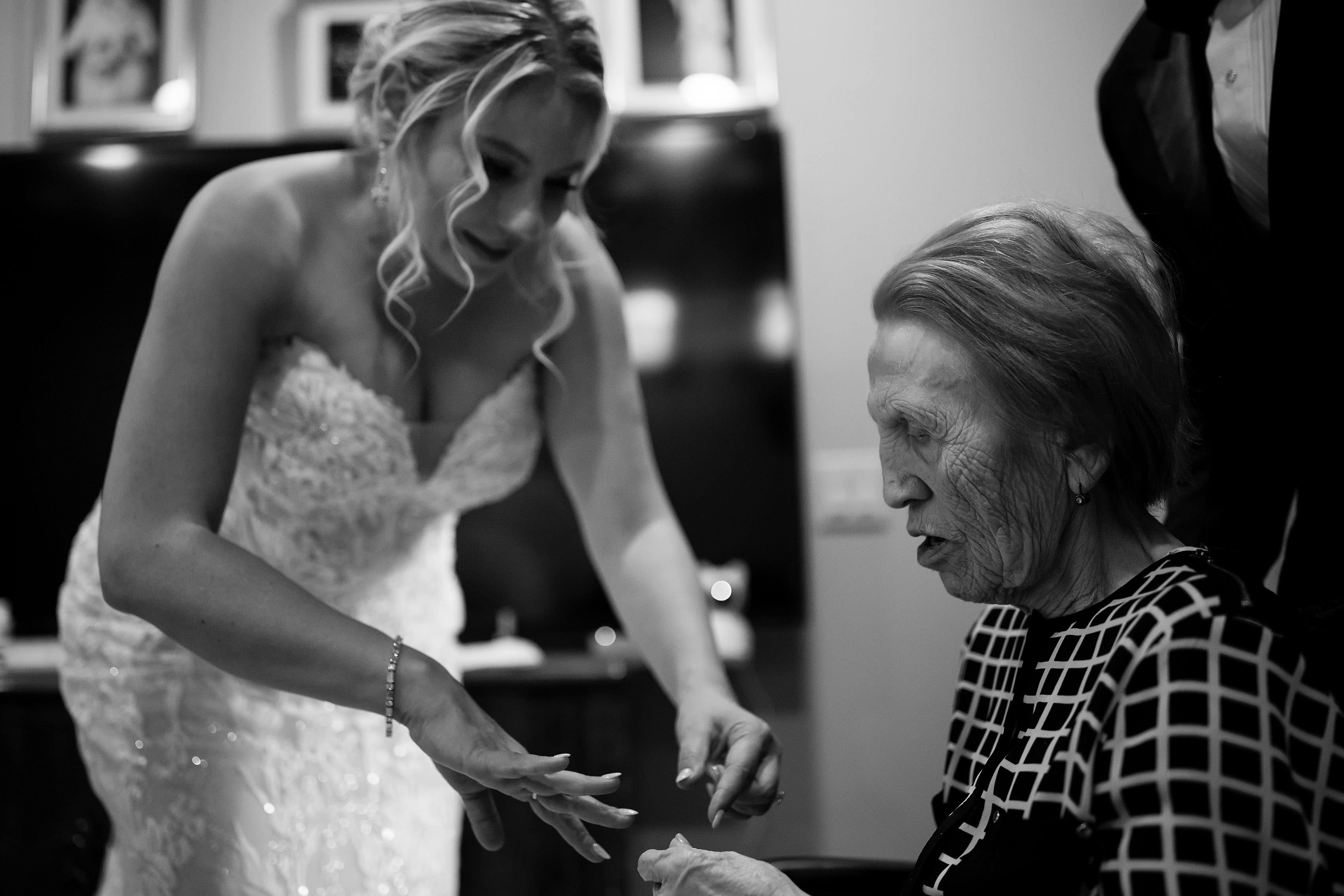 The bride receives a ring from her grandmother