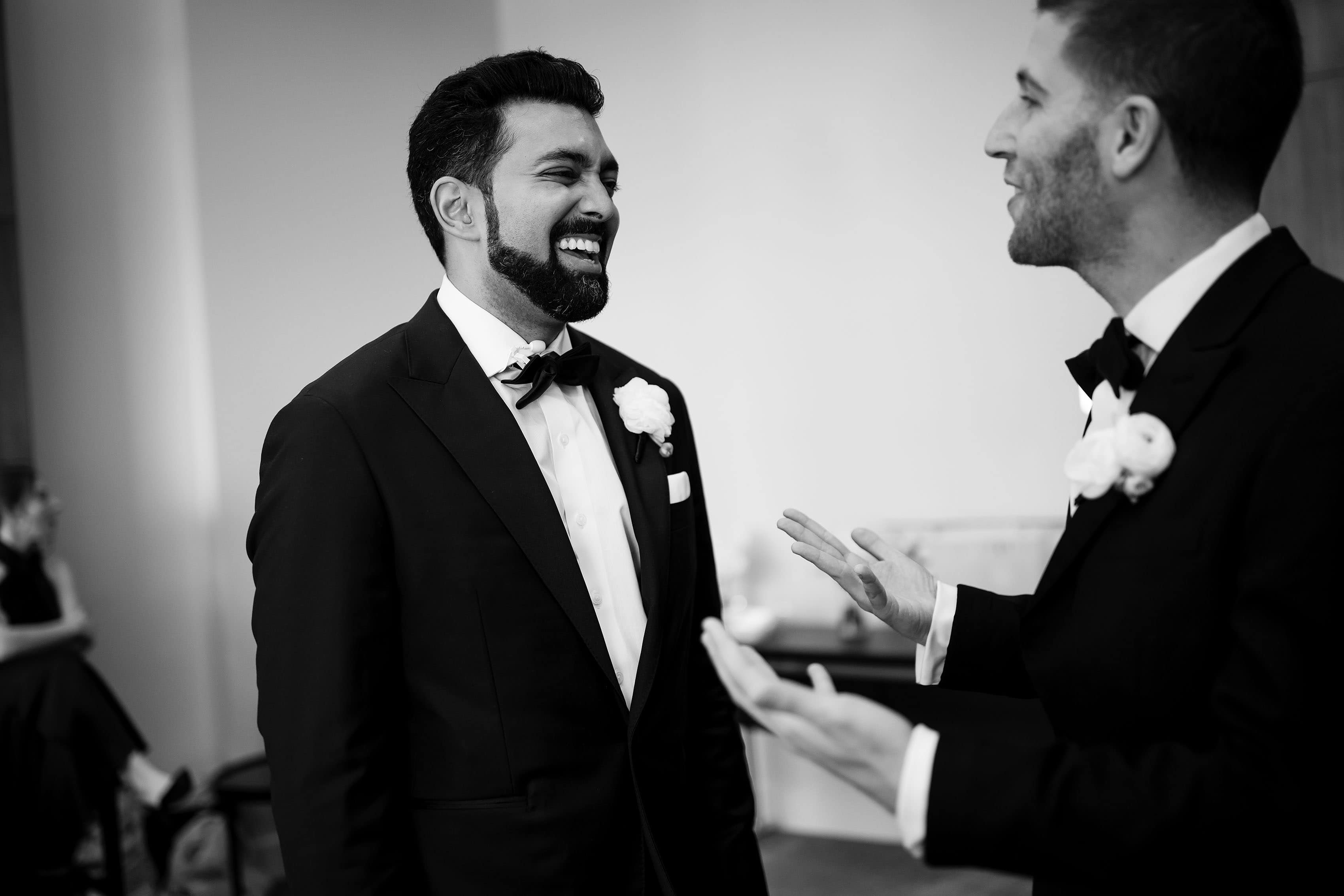 The groom shares a laugh with a family member