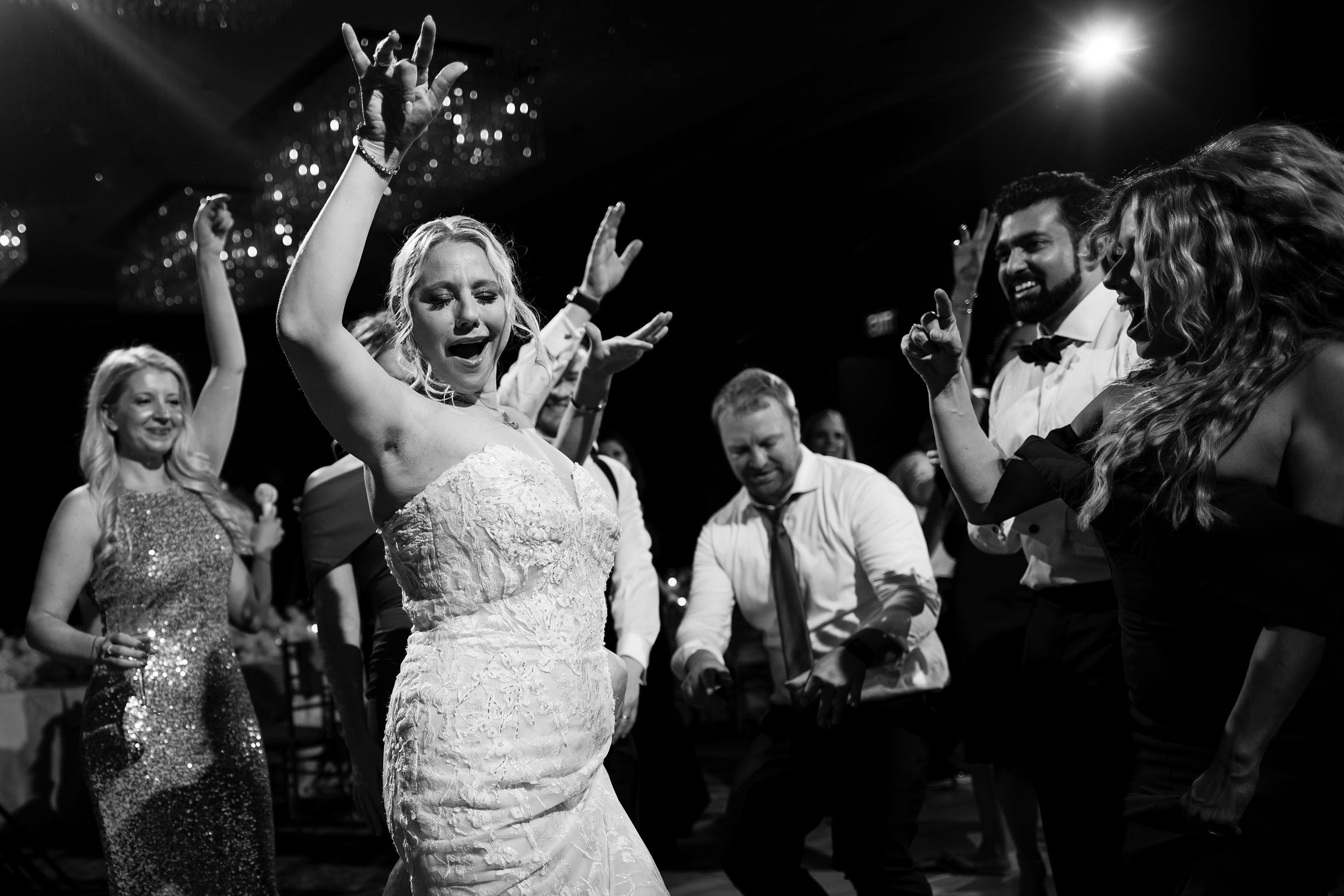Guests dance during a wedding reception at Four Seasons Hotel Denver