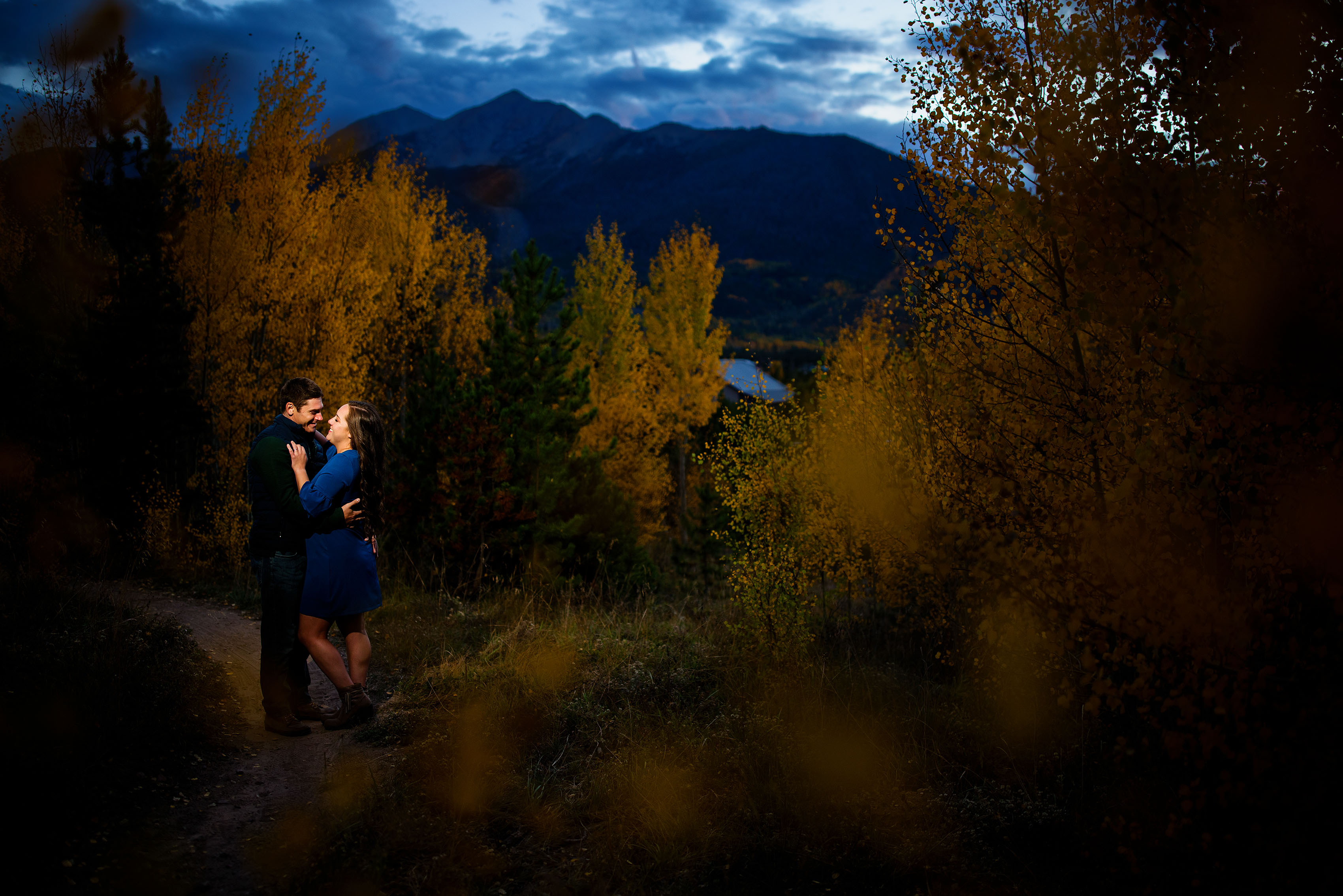 Danielle and Gabe pose at twilight on a trail near Frisco, Colorado