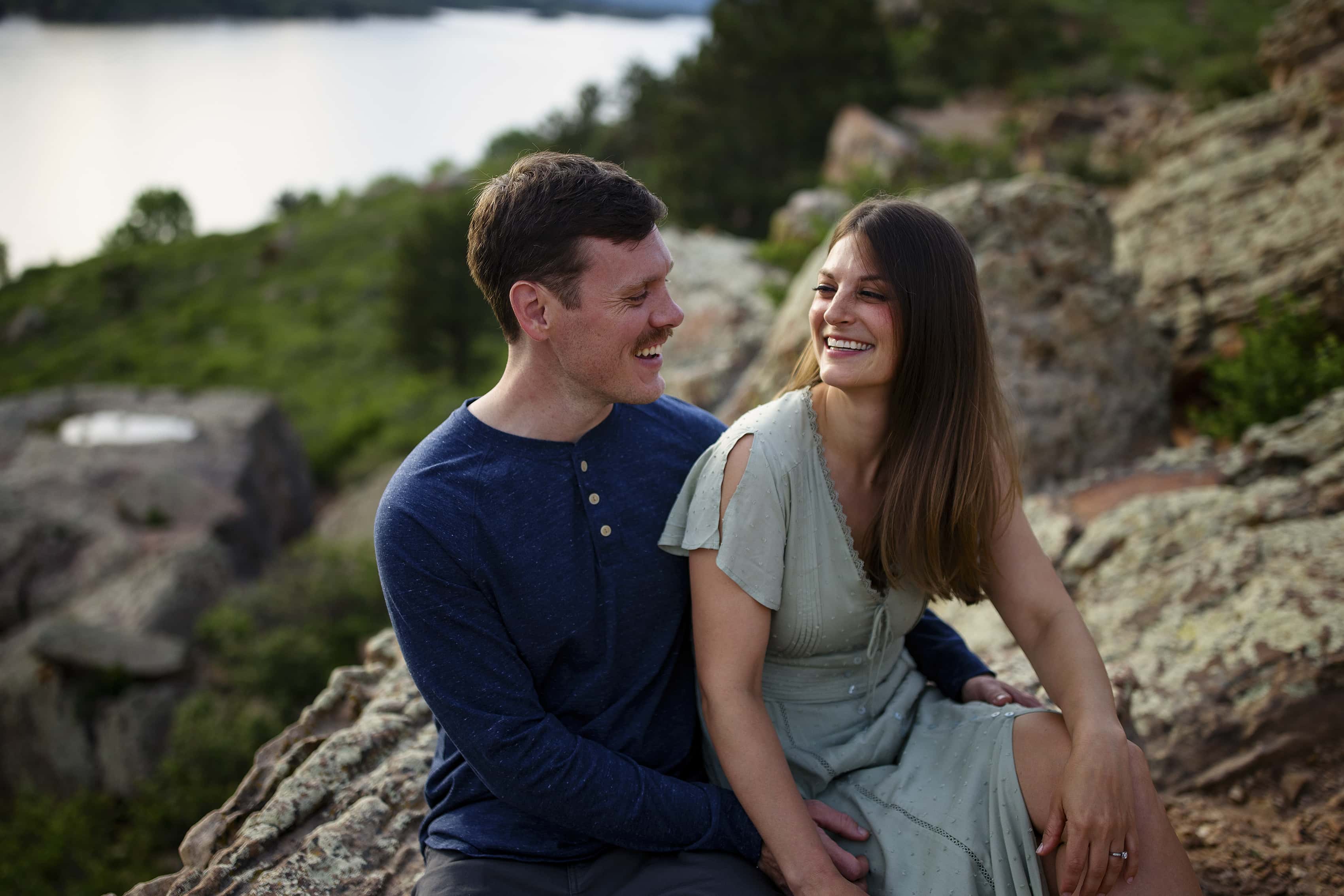 A couple laughs together near Horsetooth Reservoir in Fort Collins