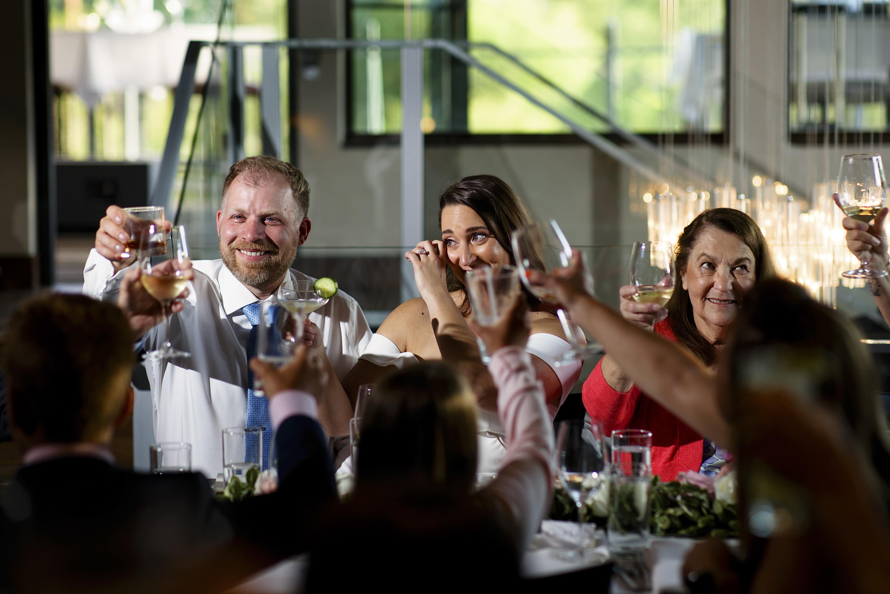 The couple toasts with guests at Aurum Food and Wine in Steamboat Springs during their micro wedding