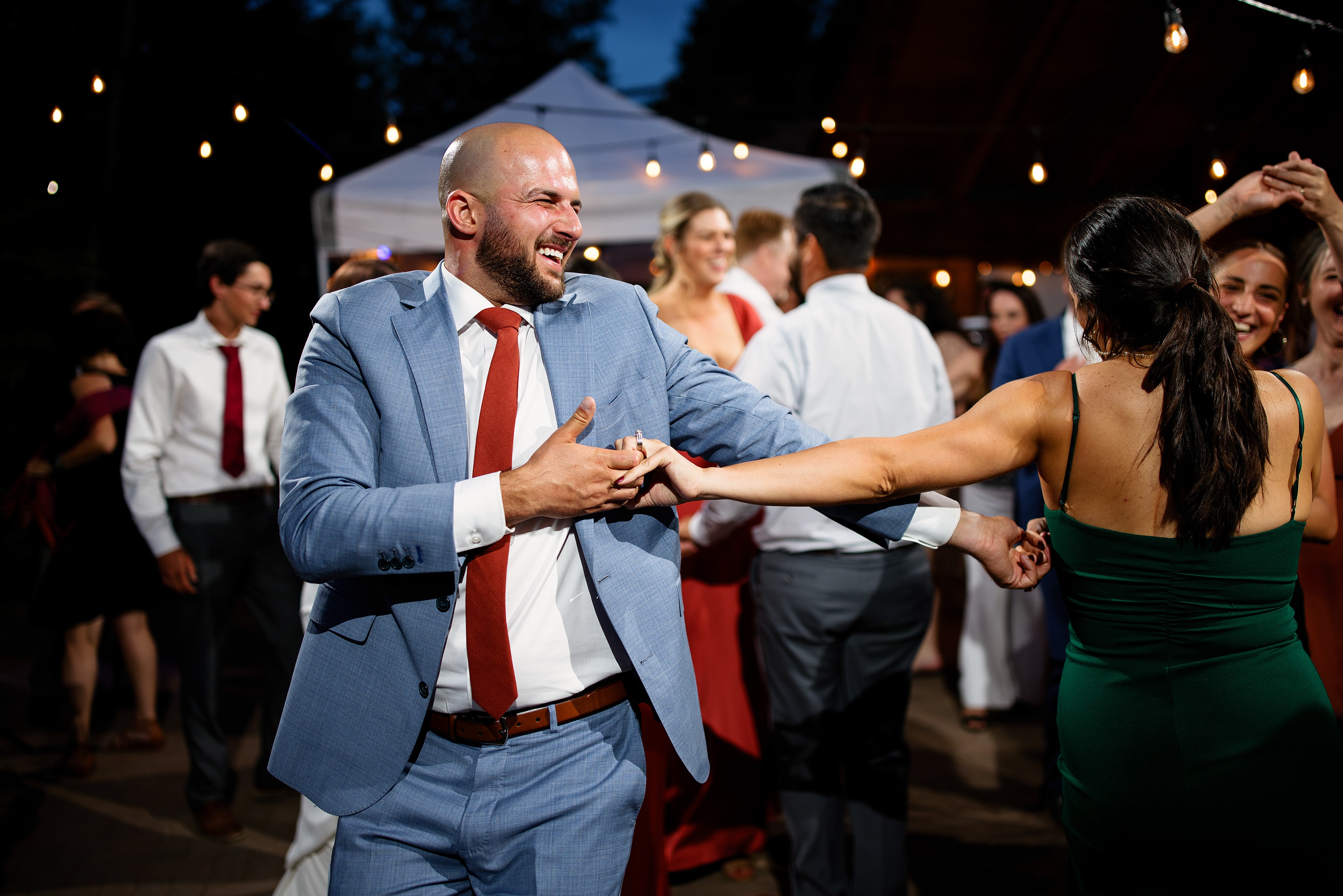 Guests dance during a wedding reception at Mountain Wedding Garden in Crested Butte