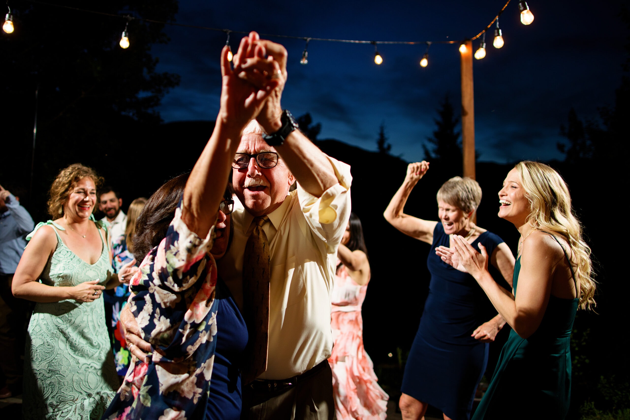 Guests dance during a wedding reception at Mountain Wedding Garden in Crested Butte