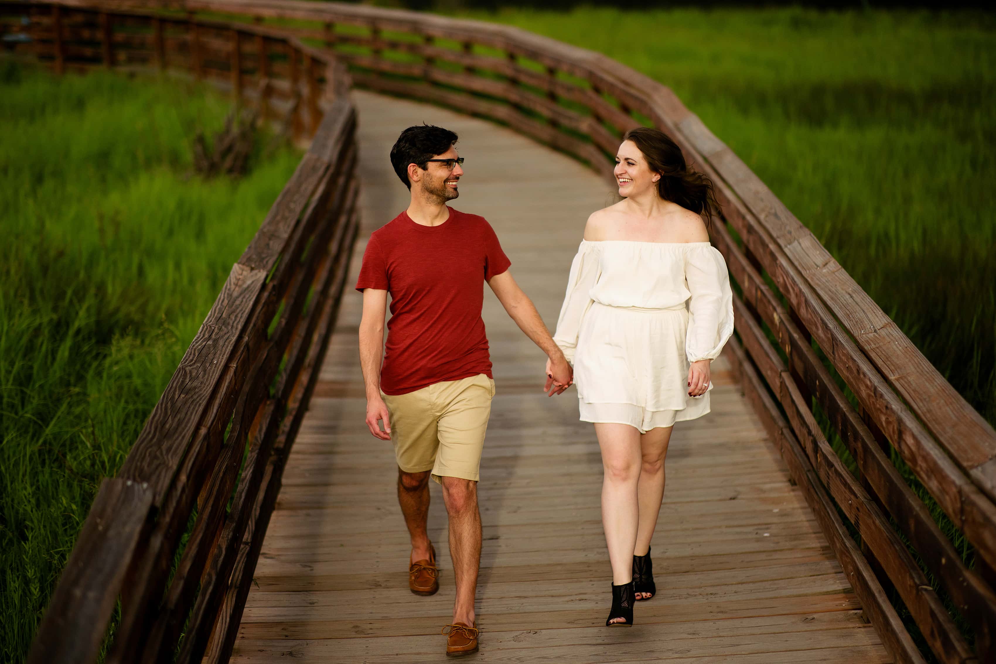 Felicia and Dan walk on the boardwalk at Evergreen Lake house